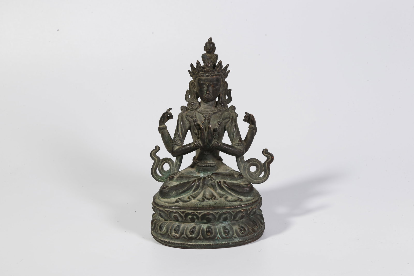 A BRONZE FOUR-ARMED GUANYIN STATUE (1 of 9)