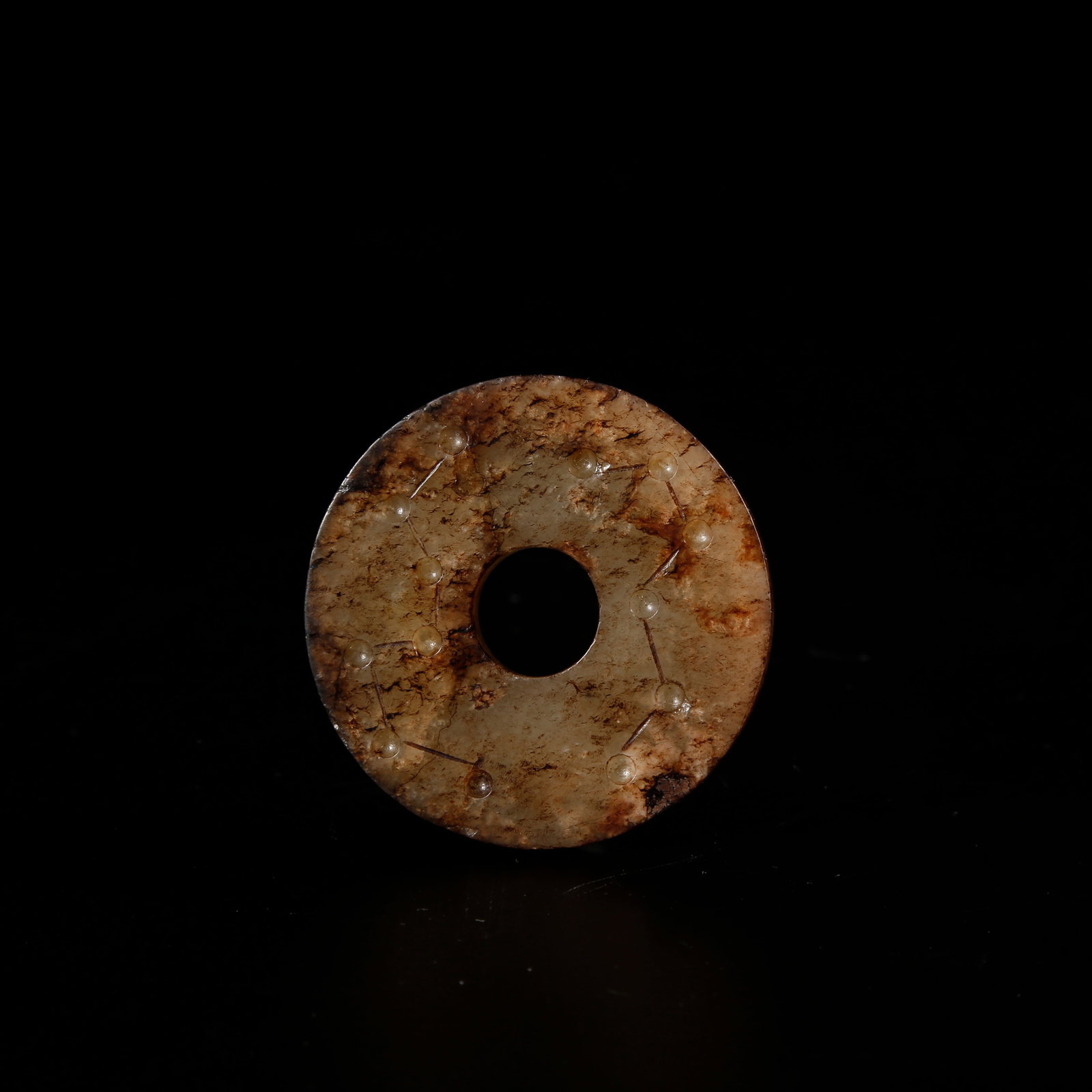 A HETIAN JADE SMALL XI-SHAPED BI DISC: Hetian jade small xi-shaped bi disc