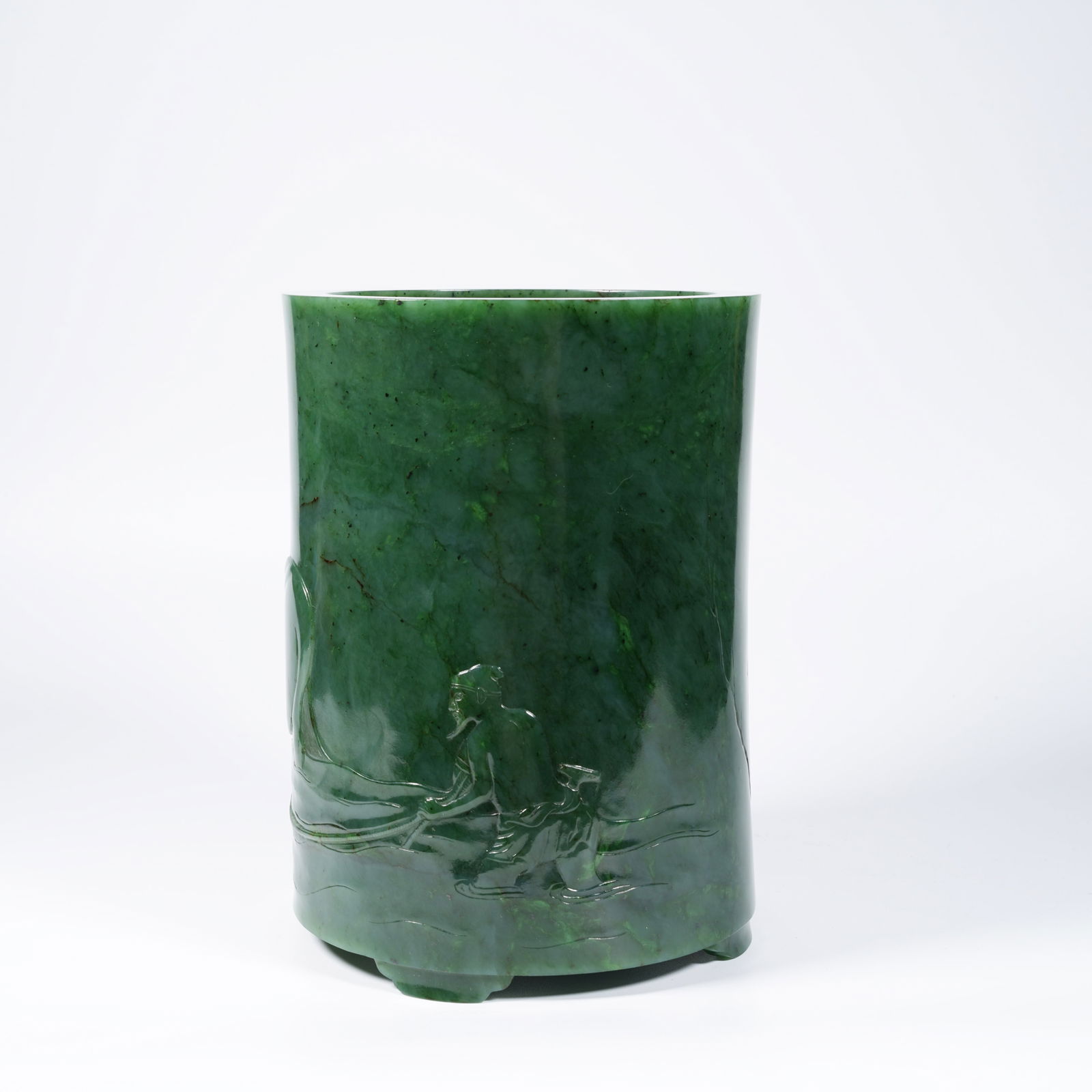 A HETIAN JASPER BRUSH POT WITH HORSE-AND-RIDER MOTIF: Hetian jasper brush pot with horse-and-rider motif