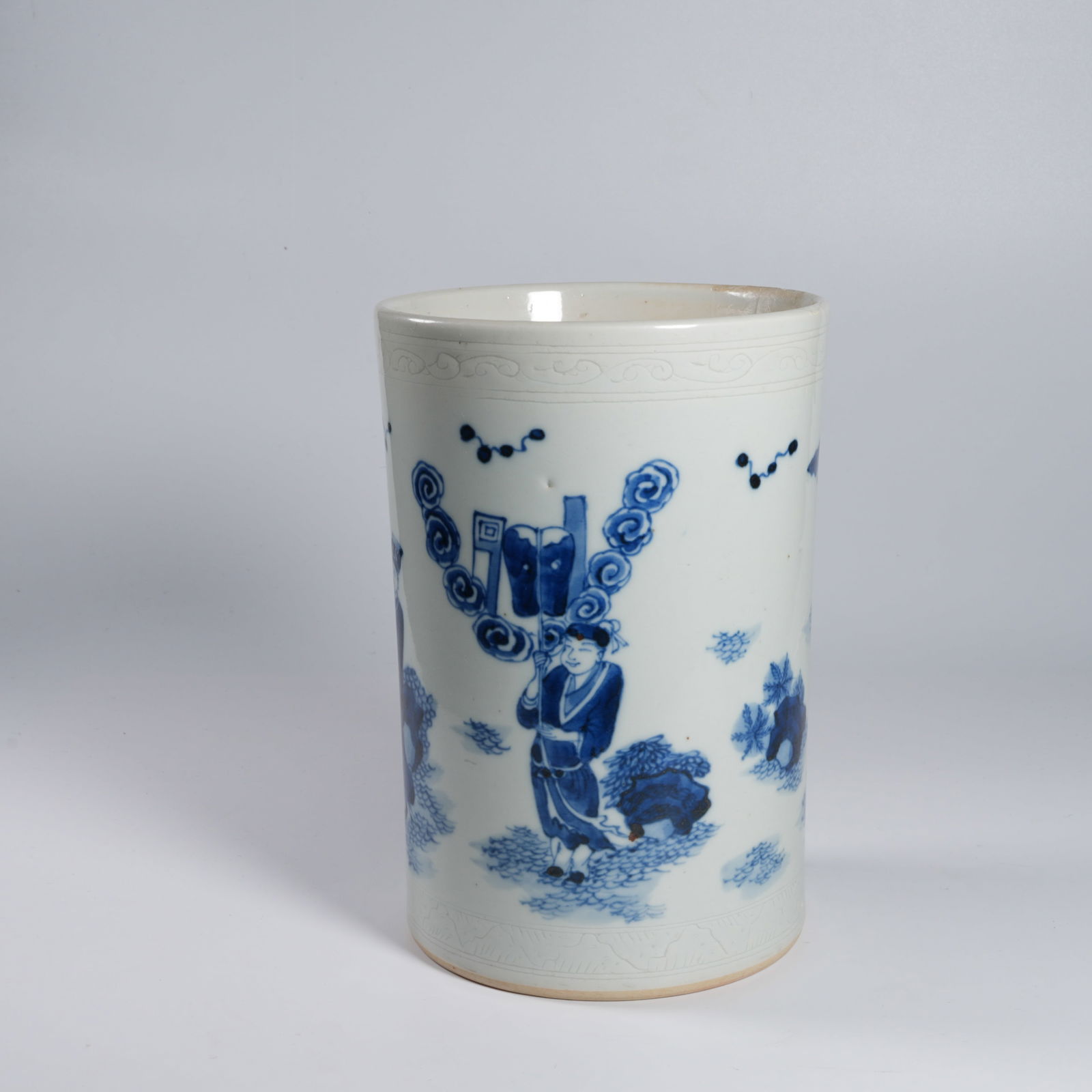 A BLUE-AND-WHITE FIGURAL BRUSH POT (SMALL, DAMAGED) (1 of 13)