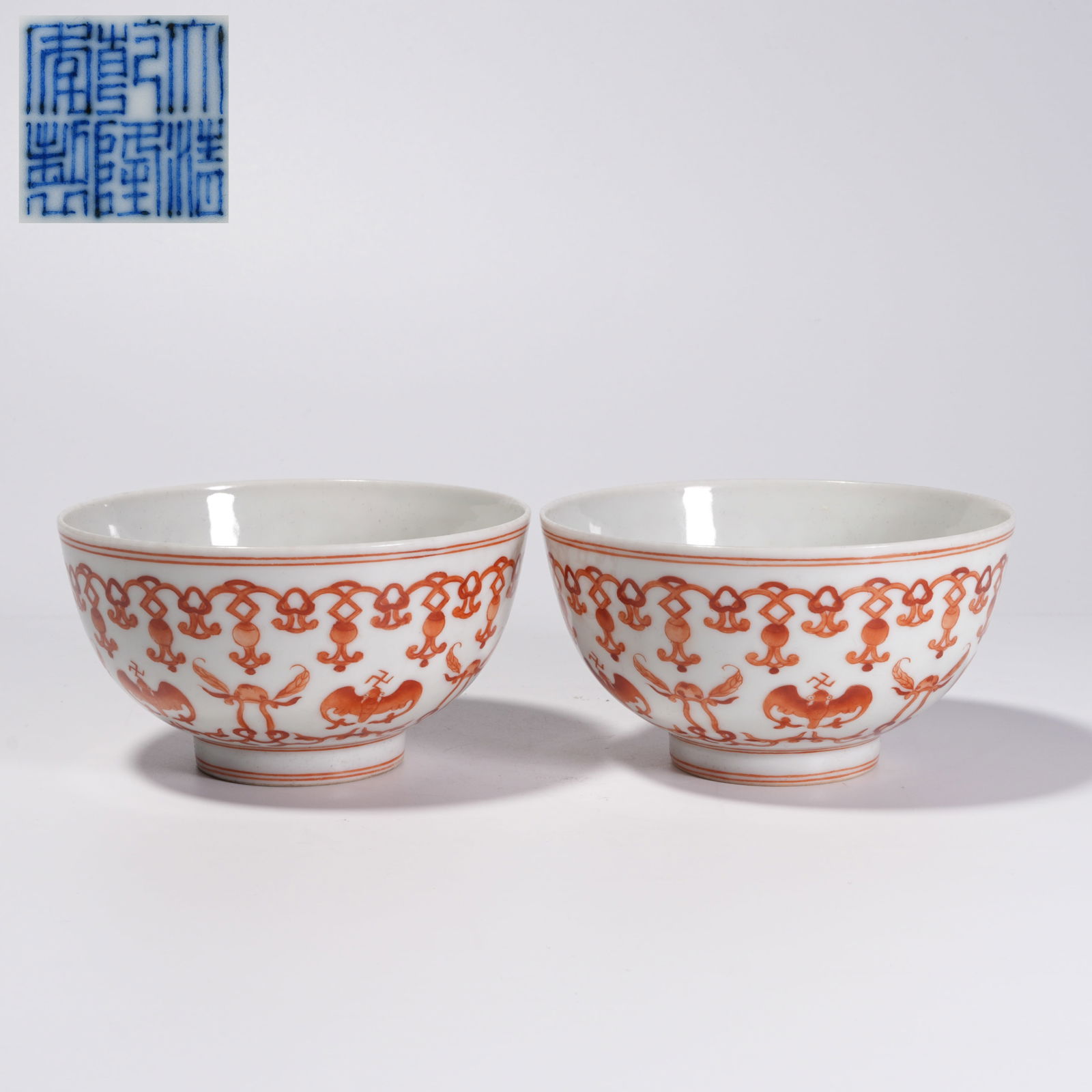 A ALUM-RED FORTUNE MOTIF BOWLS (PAIR): Alum-Red Fortune Motif Bowls (Pair)