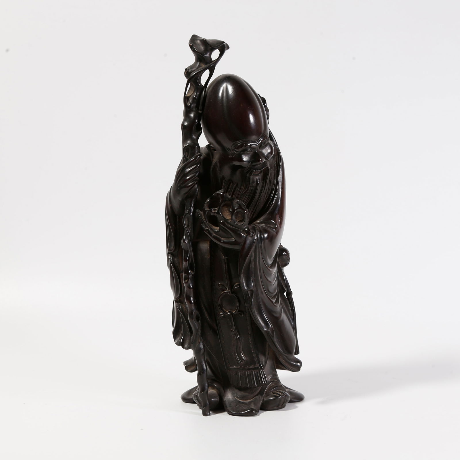 A ZITAN WOOD CARVED SHOUXING (GOD OF LONGEVITY) ORNAMENT: Zitan wood carved Shouxing (God of Longevity) ornament