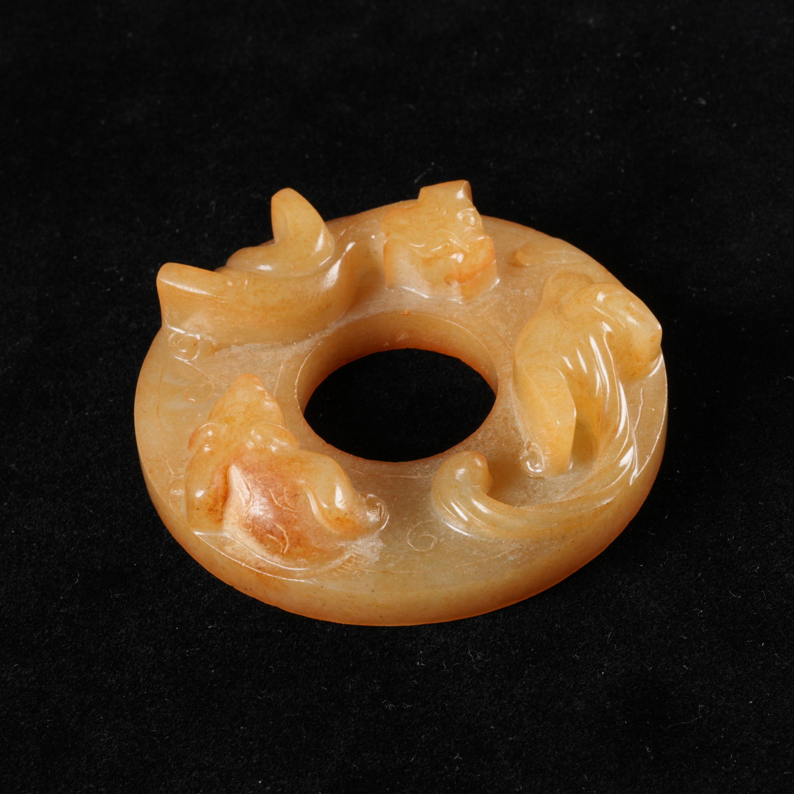 A ANCIENT JADE BI DISC WITH CHI TIGER MOTIF: Ancient jade bi disc with chi tiger motif