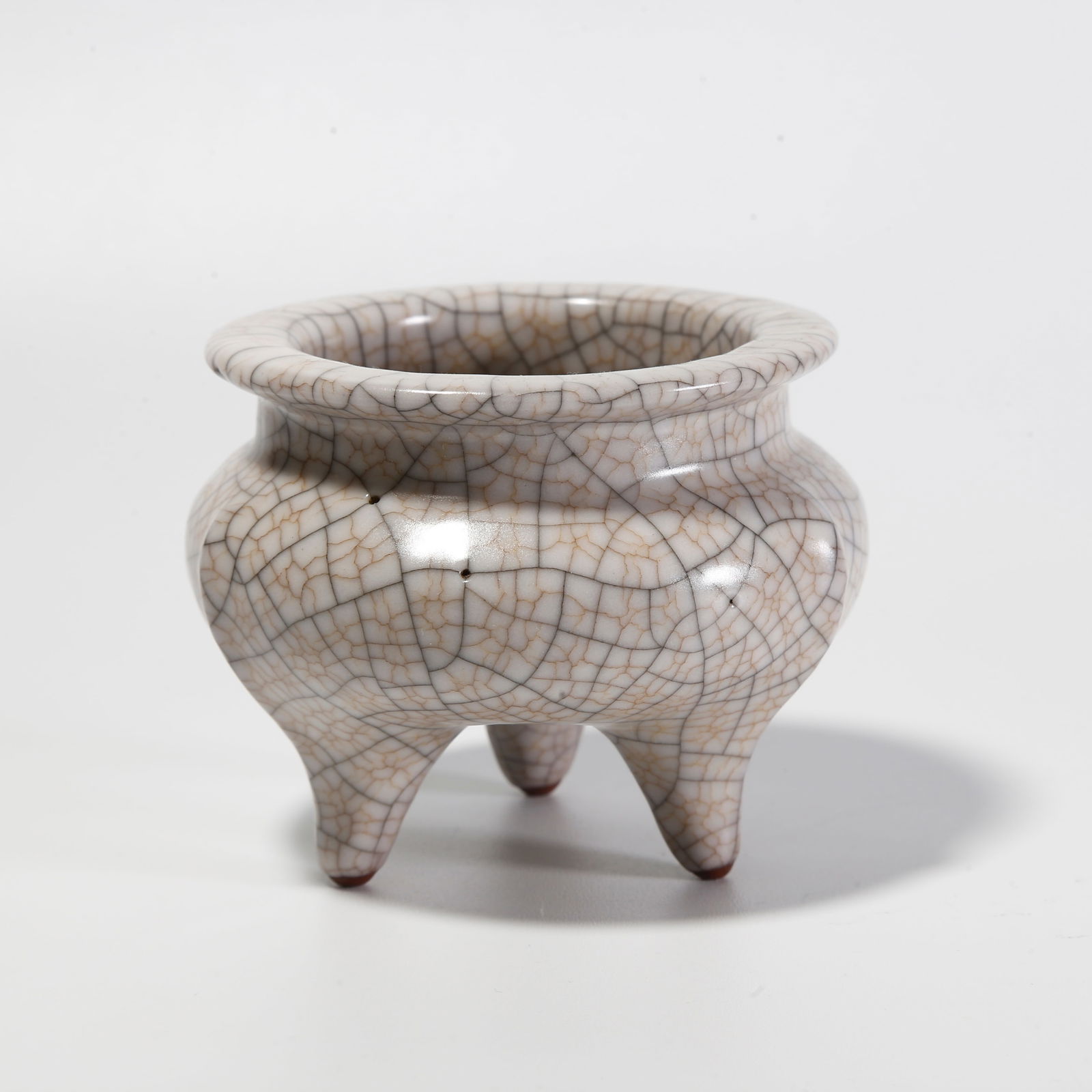 A GE WARE THREE-LEGGED INCENSE BURNER: Ge ware three-legged incense burner