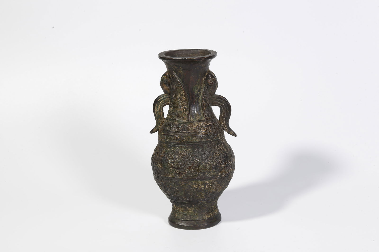 A BRONZE DOUBLE-HANDLED BOTTLE: Bronze double-handled bottle