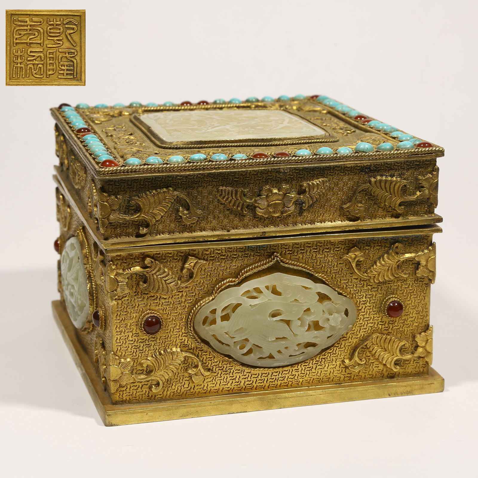 A GILDED BRONZE SEAL BOX INLAID WITH GEMSTONES AND HETIAN JADE, FLORAL AND BIRD PATTERN: Gilded Bronze Seal Box Inlaid with Gemstones and Hetian Jade, Floral and Bird Pattern