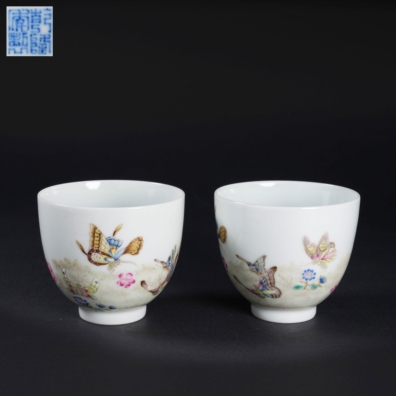 A SET OF FAMILLE-ROSE FLOWER-AND-BUTTERFLY CUPS: Set of famille-rose flower-and-butterfly cups