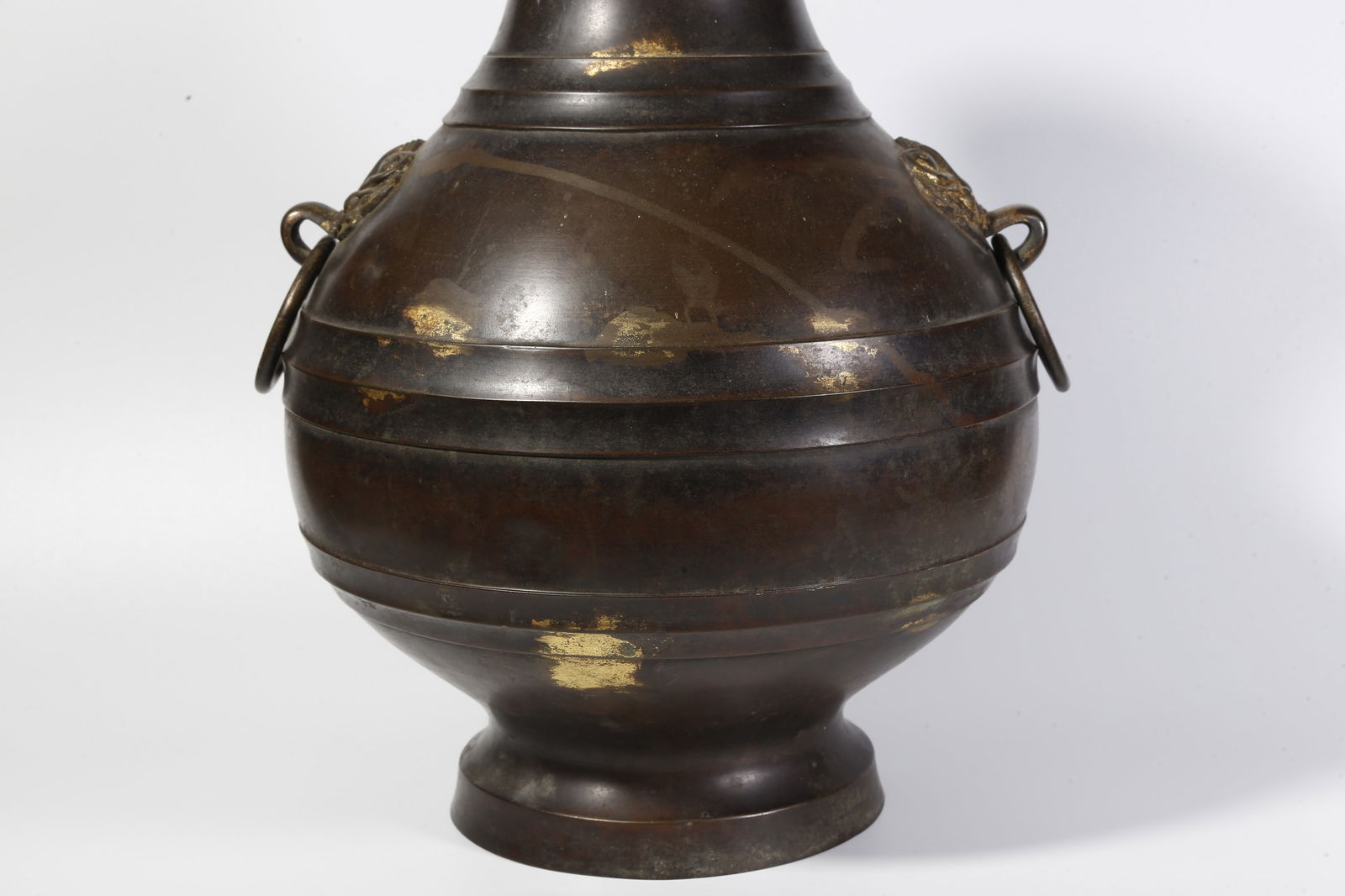 A BRONZE DOUBLE-RING-HANDLED BOTTLE - 7