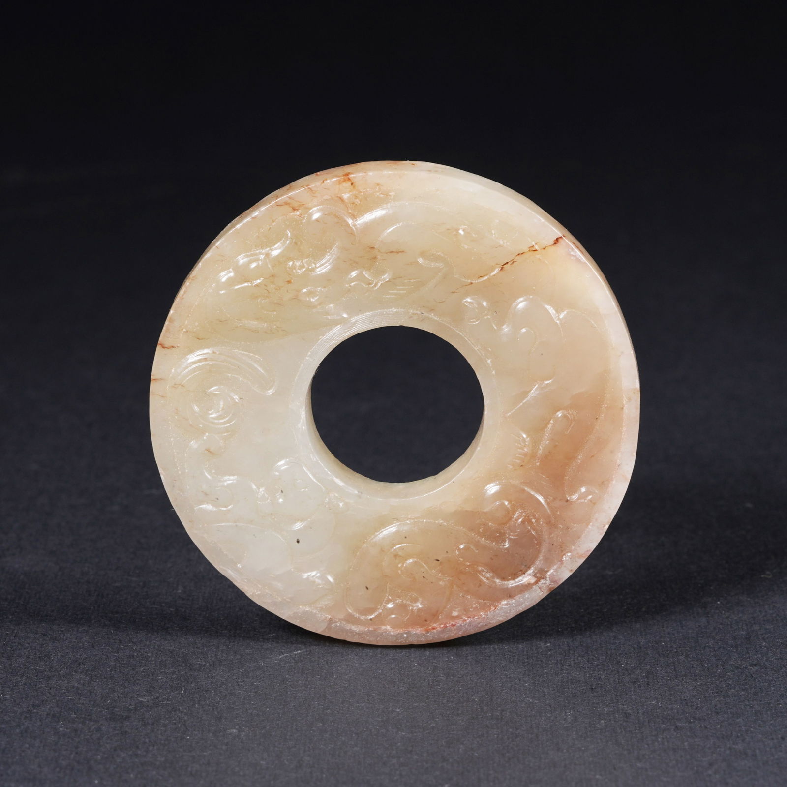 A HETIAN JADE BI DISC WITH CHI DRAGON MOTIF (1 of 10)