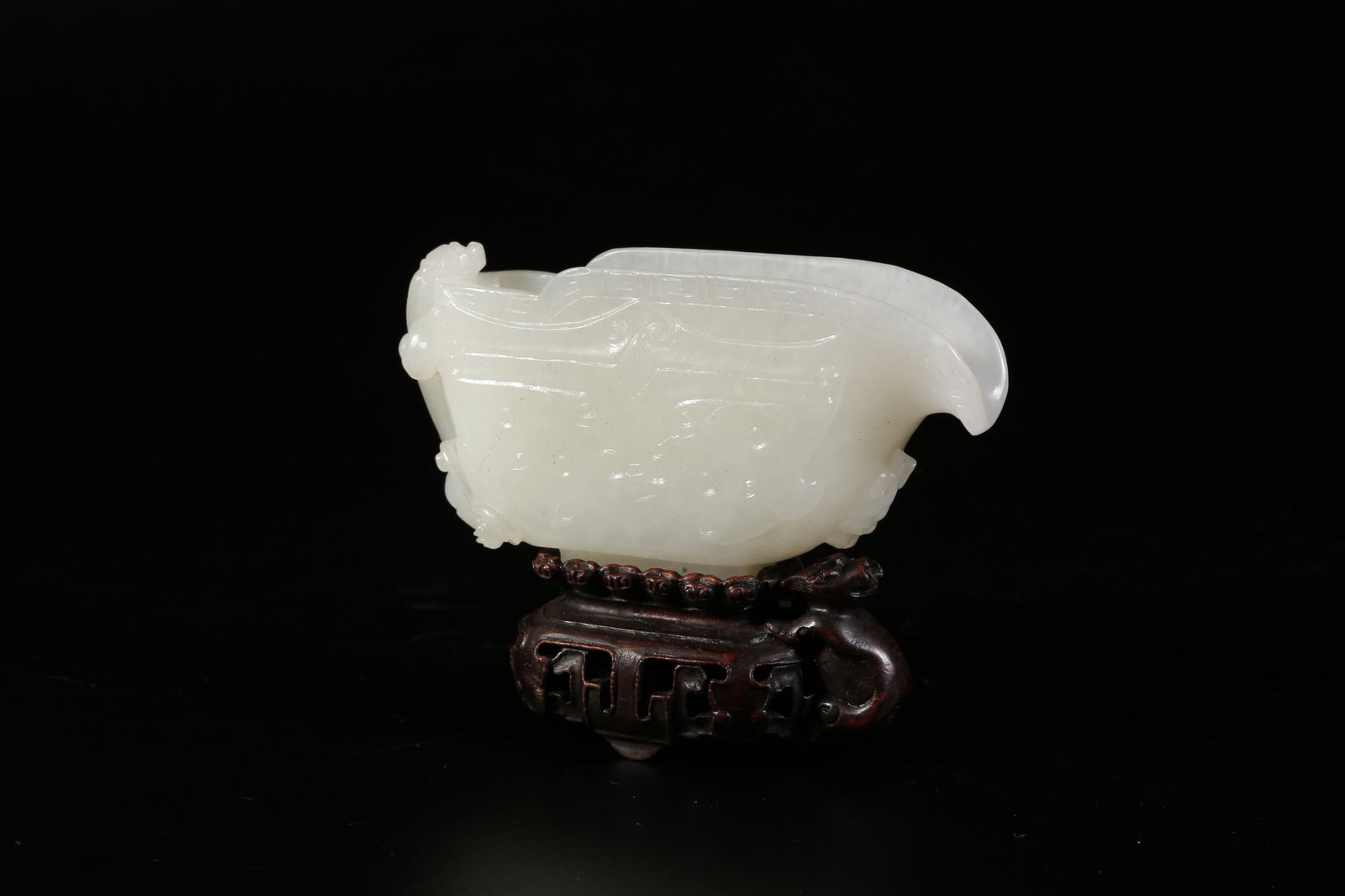 A HETIAN JADE BEAST-FACE ORNAMENT (1 of 9)