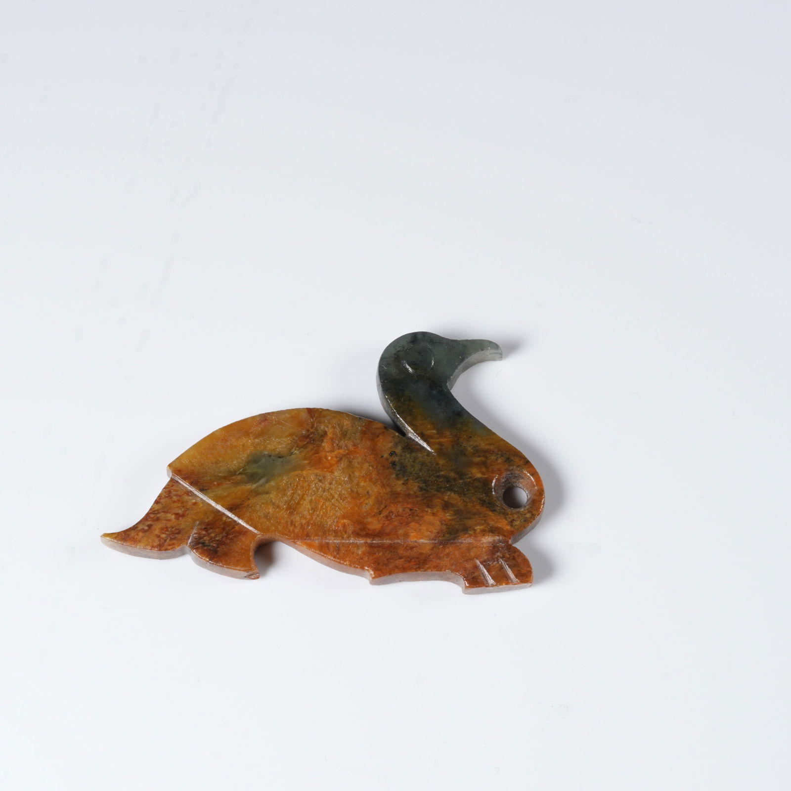 A ANCIENT JADE BIRD-SHAPED PENDANT: Ancient jade bird-shaped pendant