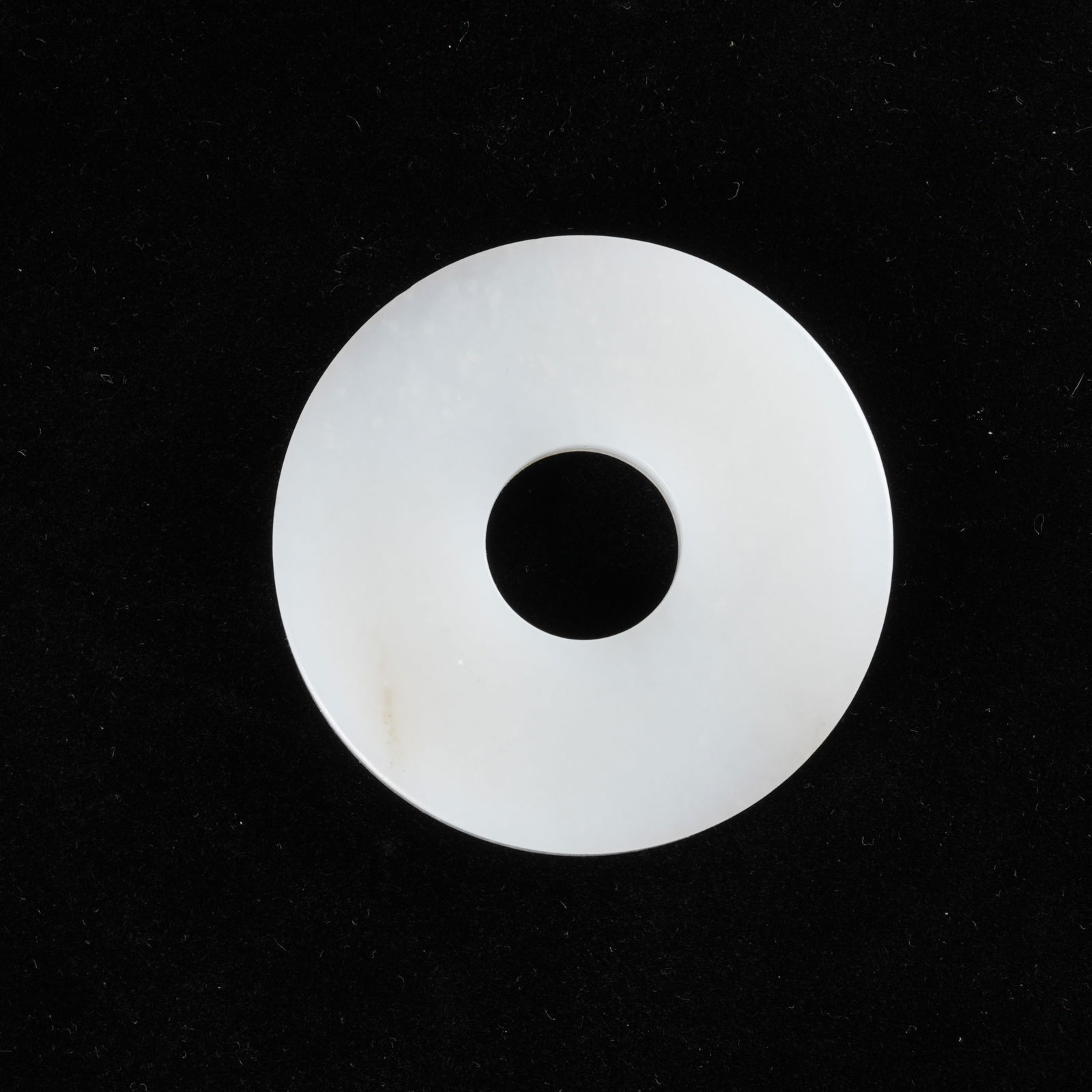 A HETIAN WHITE JADE BI DISC: Hetian white jade bi disc