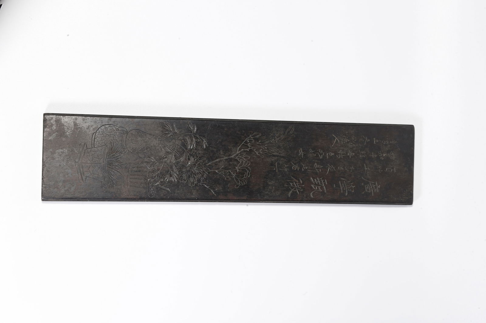 A ZITAN WOOD CARVED PAPERWEIGHT WITH FLORAL MOTIF: Zitan wood carved paperweight with floral motif