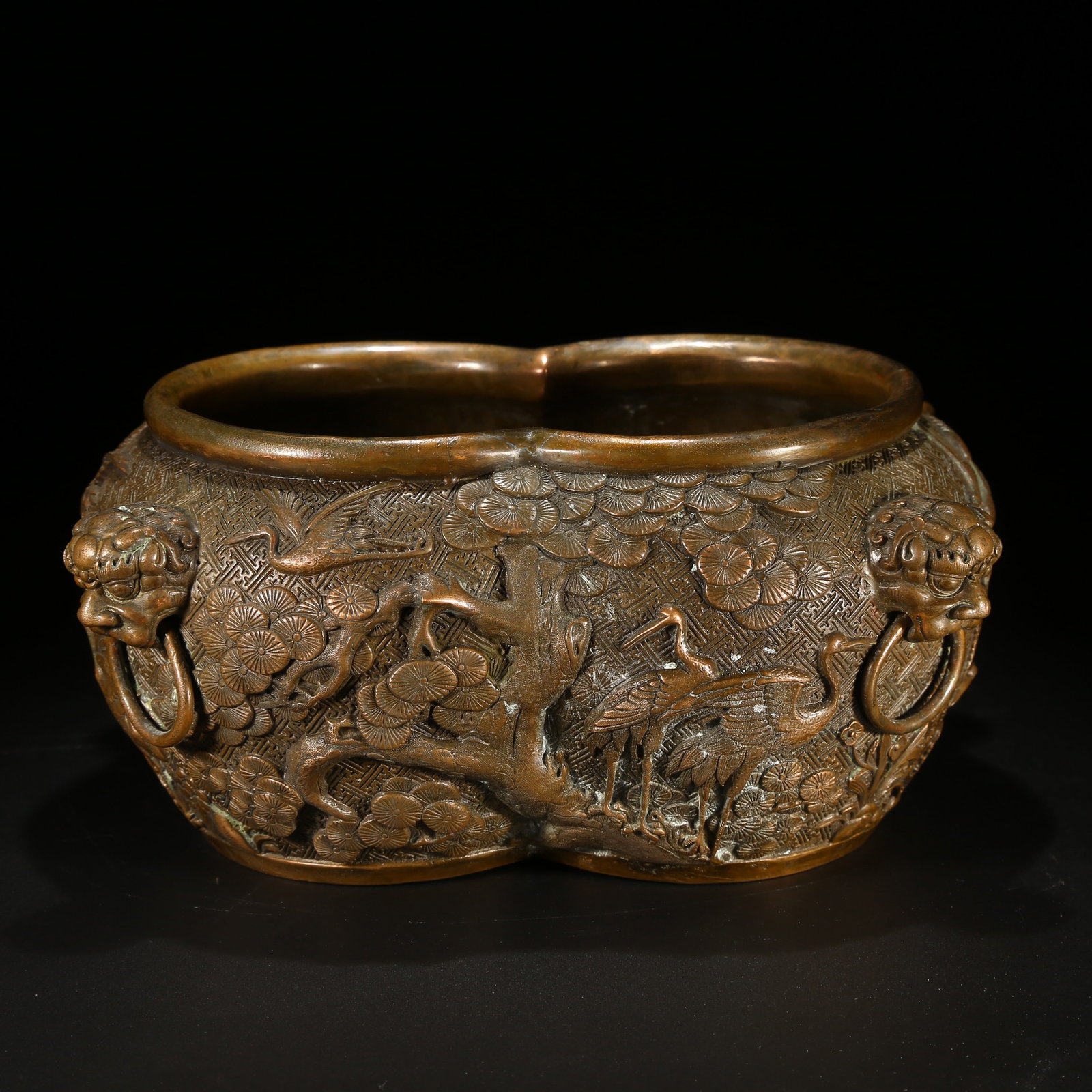 A BRONZE DOUBLE CENSER WITH PINE, CRANE, AND LION-HANDLED DESIGN SYMBOLIZING LONGEVITY: Bronze Double Censer with Pine, Crane, and Lion-Handled Design Symbolizing Longevity
