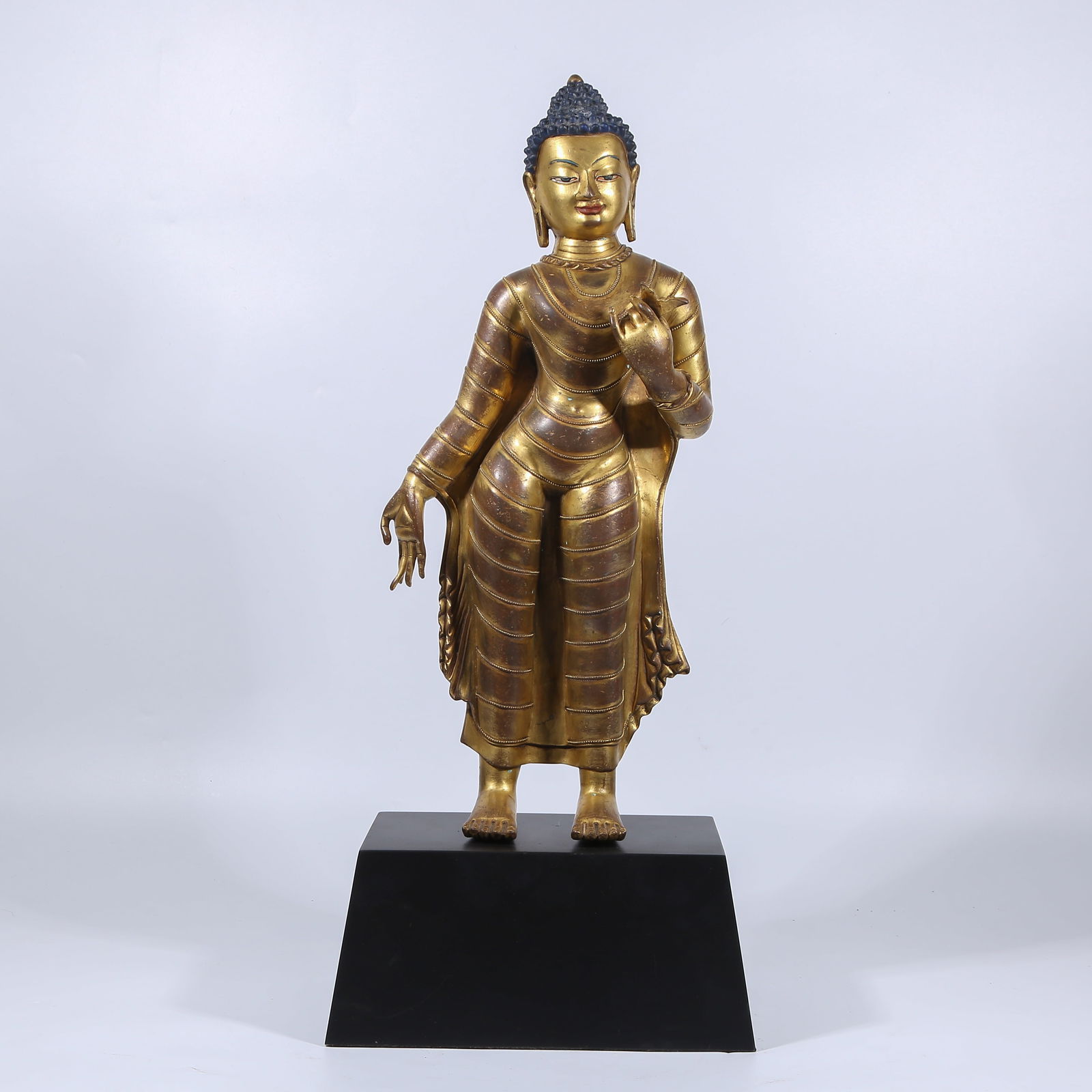A GILT BRONZE STANDING SHAKYAMUNI BUDDHA STATUE (1 of 7)