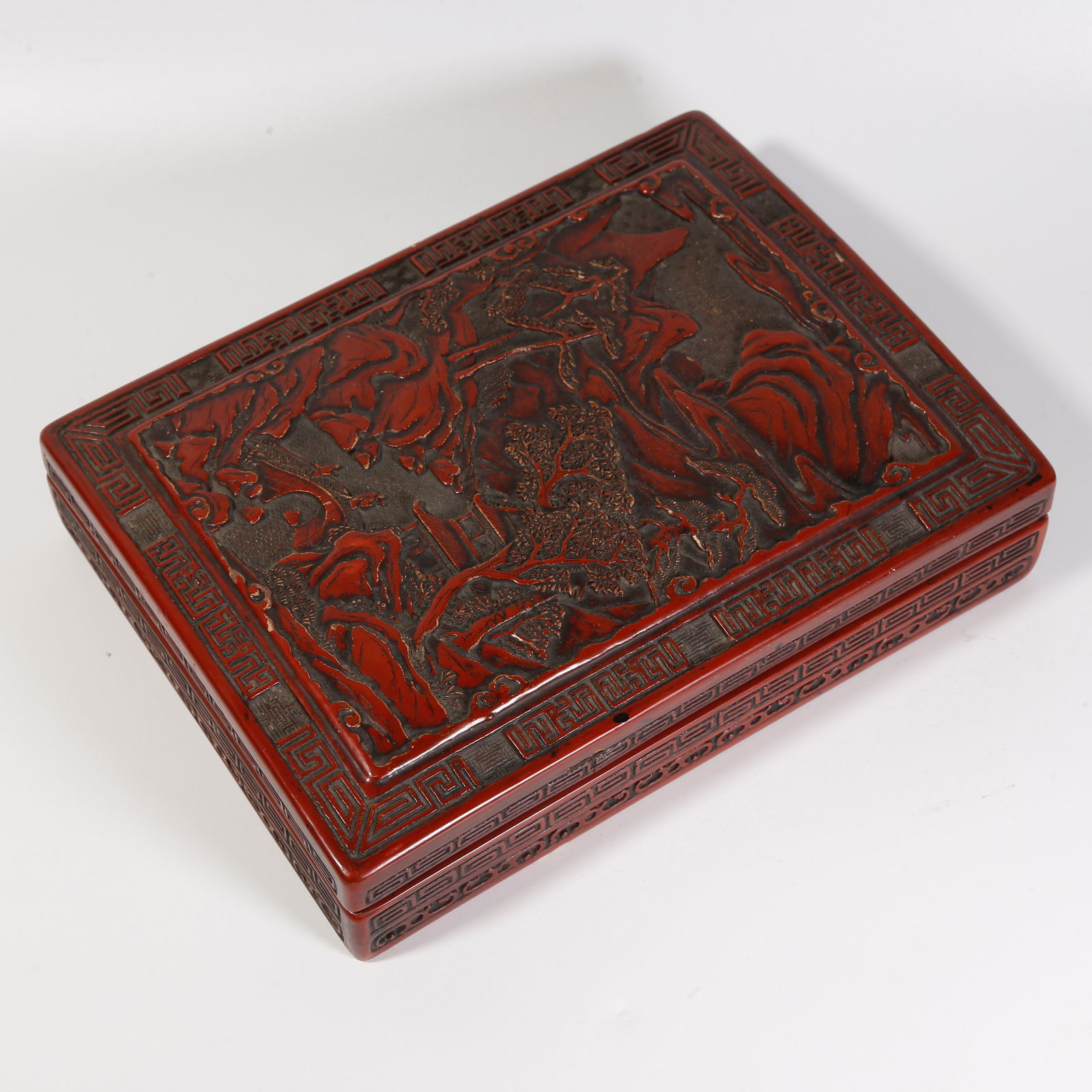 A CARVED RED LACQUER COVERED BOX WITH LANDSCAPE MOTIF (1 of 9)