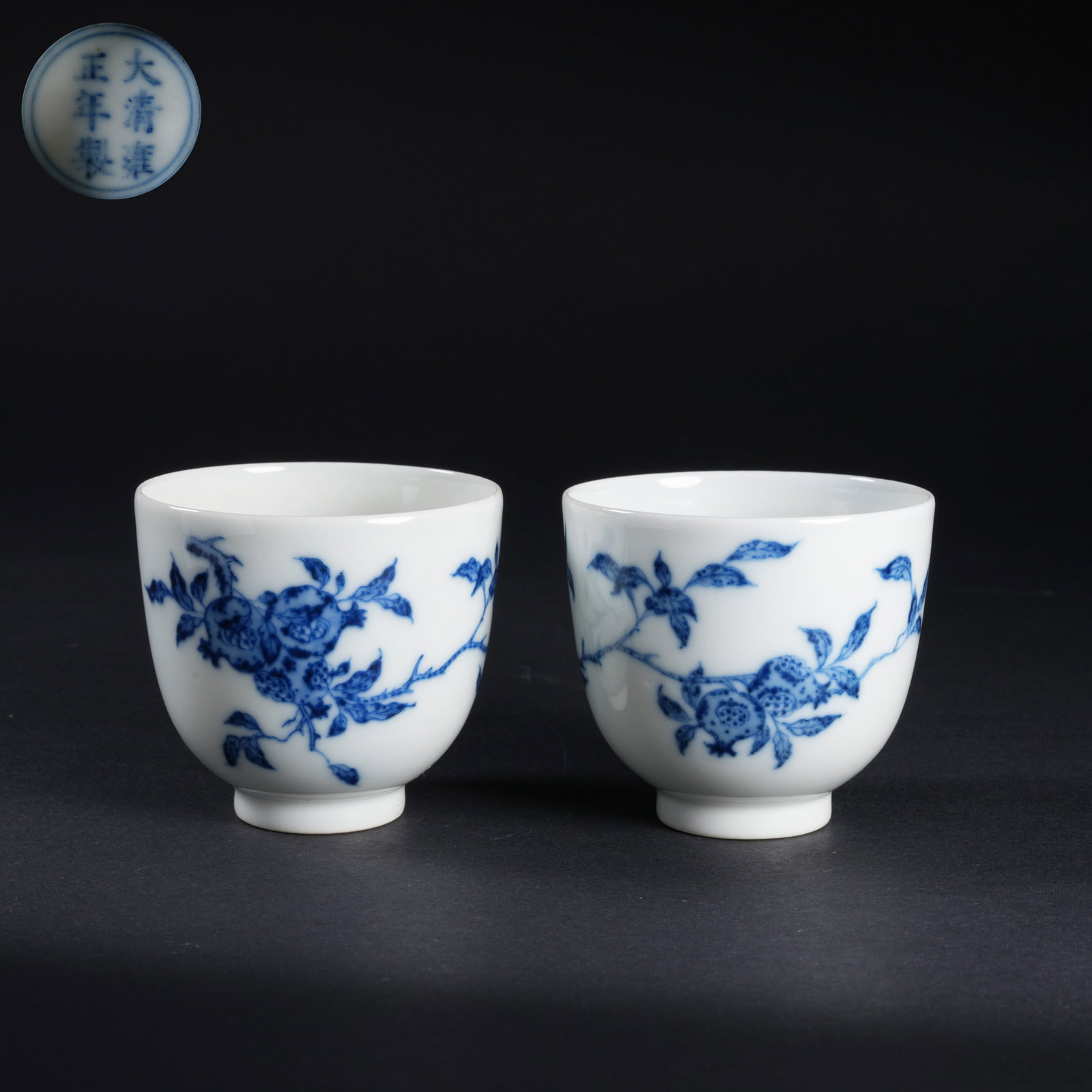 A SET OF BLUE-AND-WHITE "MANY SONS" MOTIF CUPS: Set of blue-and-white "Many Sons" motif cups