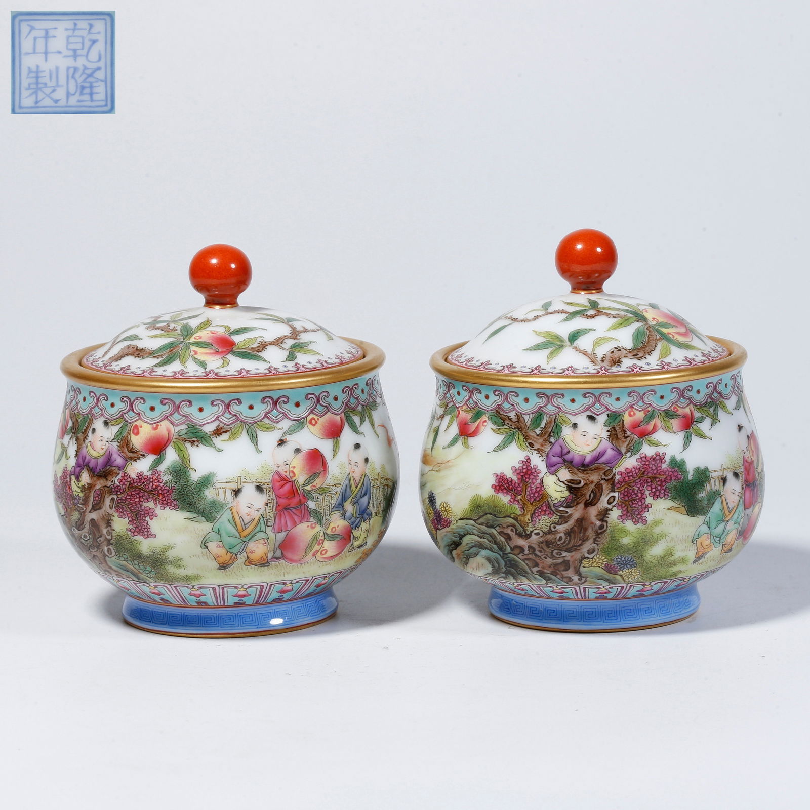 A PAIR OF FAMILLE-ROSE LIDDED JARS WITH BOYS AT PLAY MOTIF: Pair of famille-rose lidded jars with boys at play motif