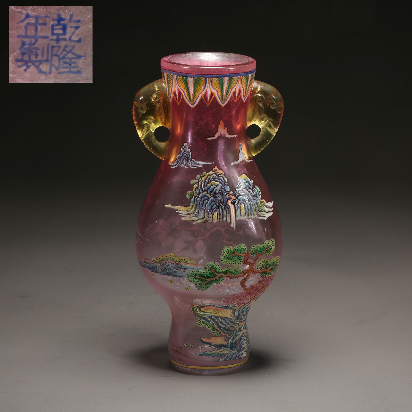 A GLASS WITH PAINTED ENAMEL LANDSCAPE ELEPHANT-HANDLED VASE: Glass with Painted Enamel Landscape Elephant-Handled Vase