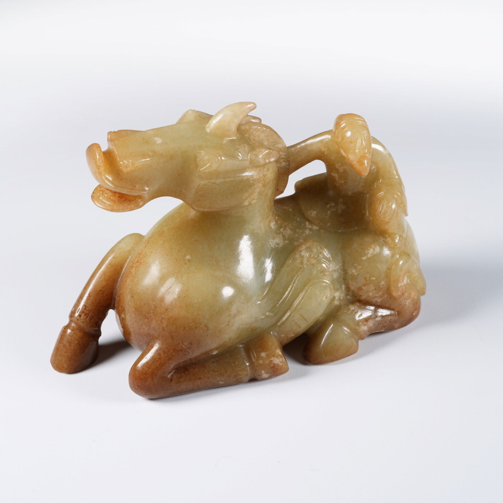 A ANCIENT JADE "BARBARIAN TAMING BEAST" ORNAMENT: Ancient jade "barbarian taming beast" ornament