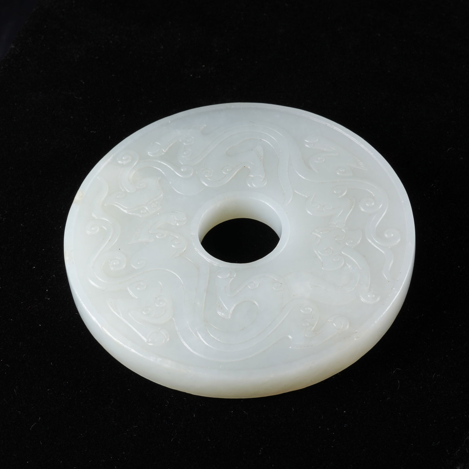 A HETIAN JADE BI DISC WITH CHI DRAGON MOTIF (1 of 9)