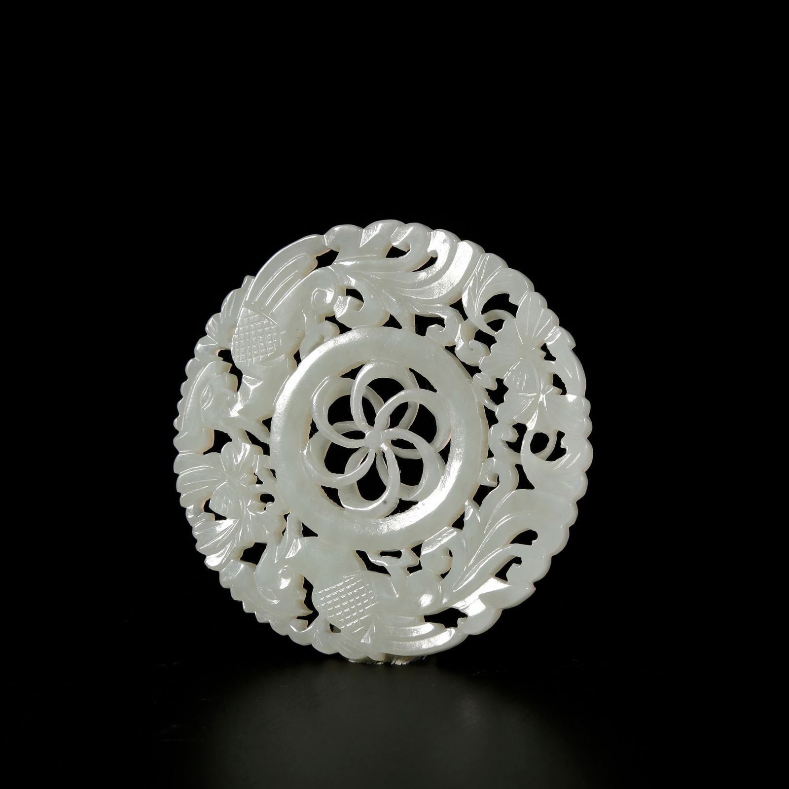 A HETIAN JADE PENDANT WITH PHOENIX MOTIF: Hetian jade pendant with phoenix motif