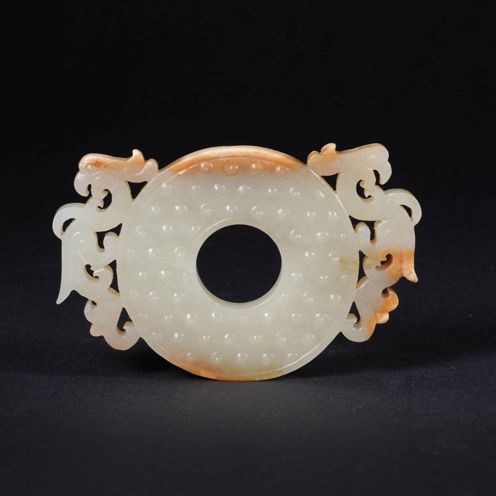 A HETIAN JADE BI DISC WITH RAISED RIM (CHU KUO BI): Hetian jade bi disc with raised rim (chu kuo bi)