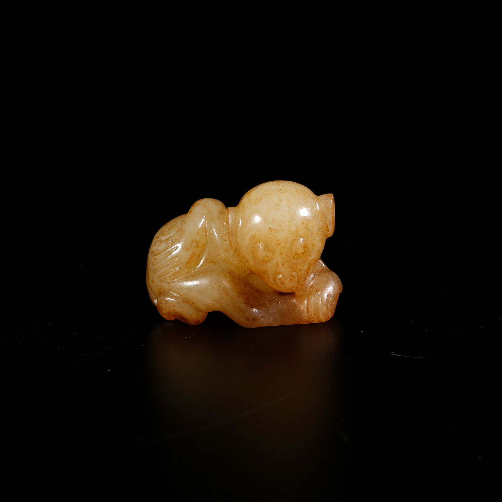 A HETIAN JADE MONKEY-SHAPED ORNAMENT: Hetian jade monkey-shaped ornament