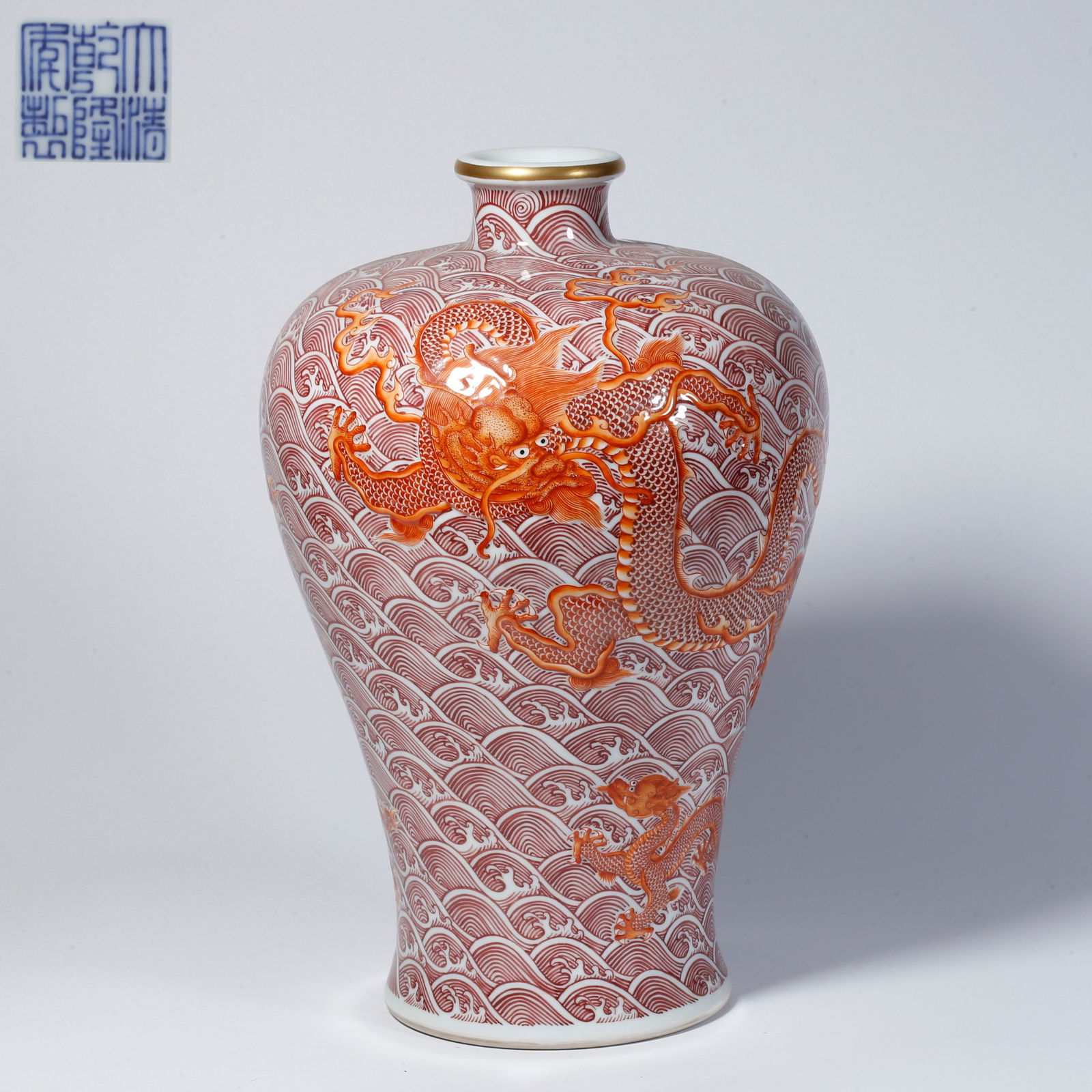 A UNDERGLAZE RED LARGE MEIPING VASE WITH SEA WAVE AND DRAGON MOTIF: Underglaze red large meiping vase with sea wave and dragon motif