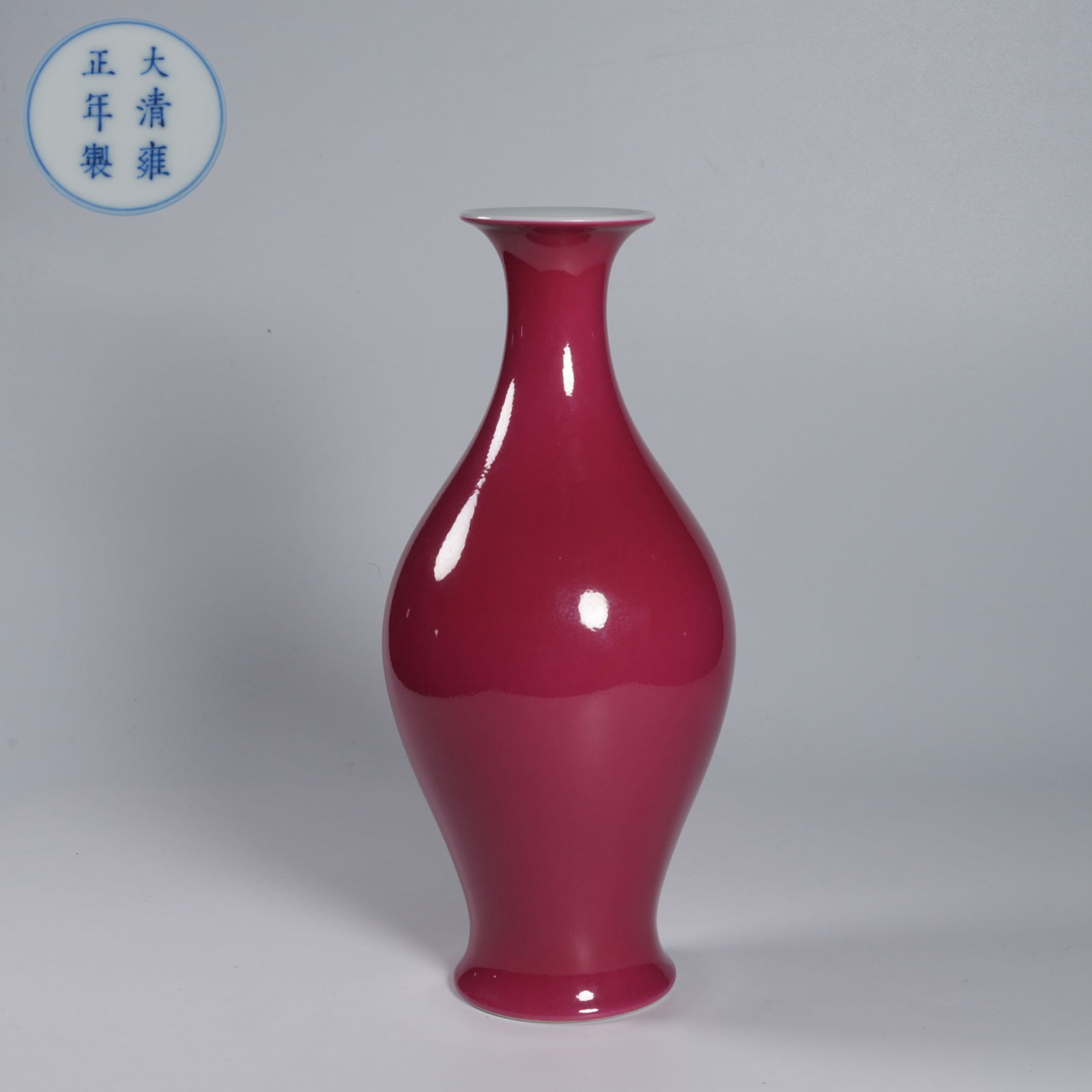 A RUBY-RED GLAZED GARLIC-MOUTH VASE: Ruby-red glazed garlic-mouth vase