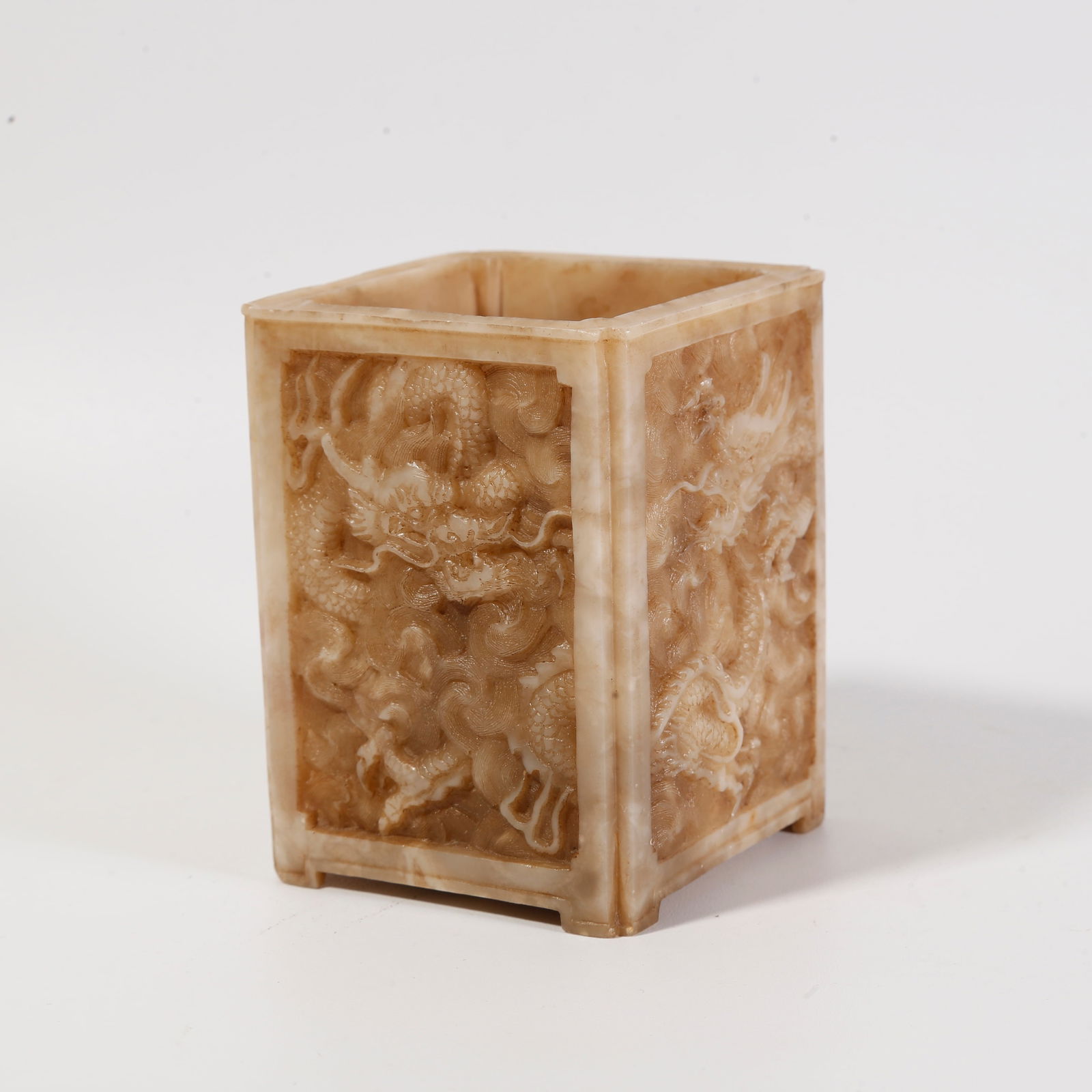 A SHOUSHAN STONE BRUSH POT WITH CLOUD-AND-DRAGON MOTIF: Shoushan stone brush pot with cloud-and-dragon motif