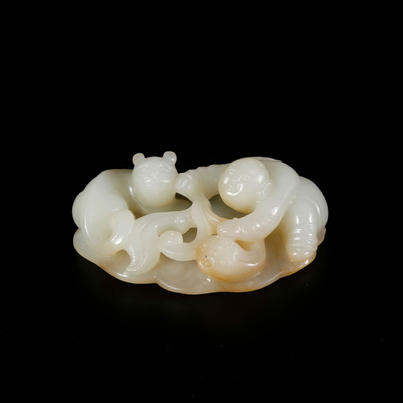 A HETIAN JADE BOY-SHAPED ORNAMENT: Hetian jade boy-shaped ornament