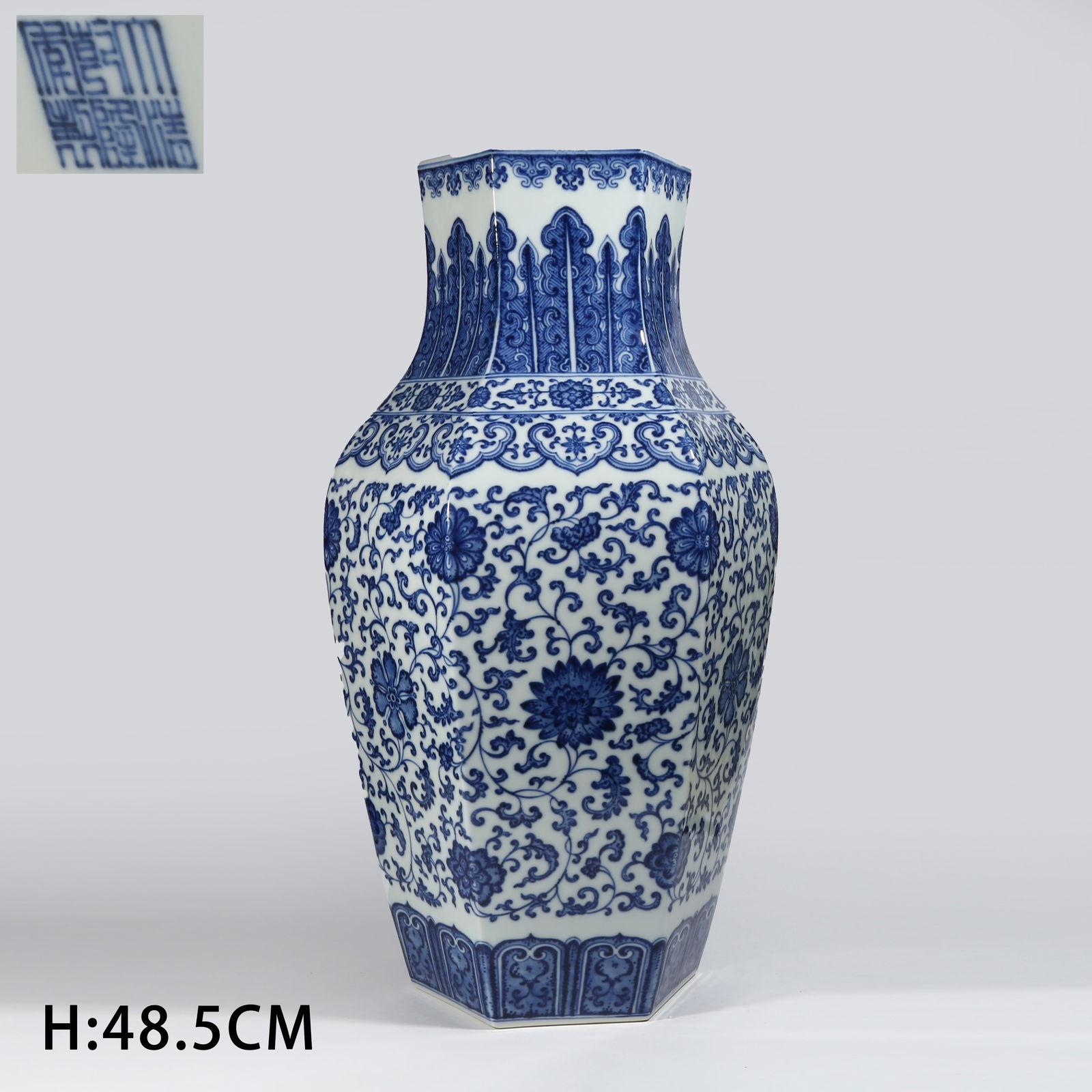 A BLUE AND WHITE HEXAGONAL VASE WITH SCROLLING FLORAL PATTERN: Blue and white hexagonal vase with scrolling floral pattern