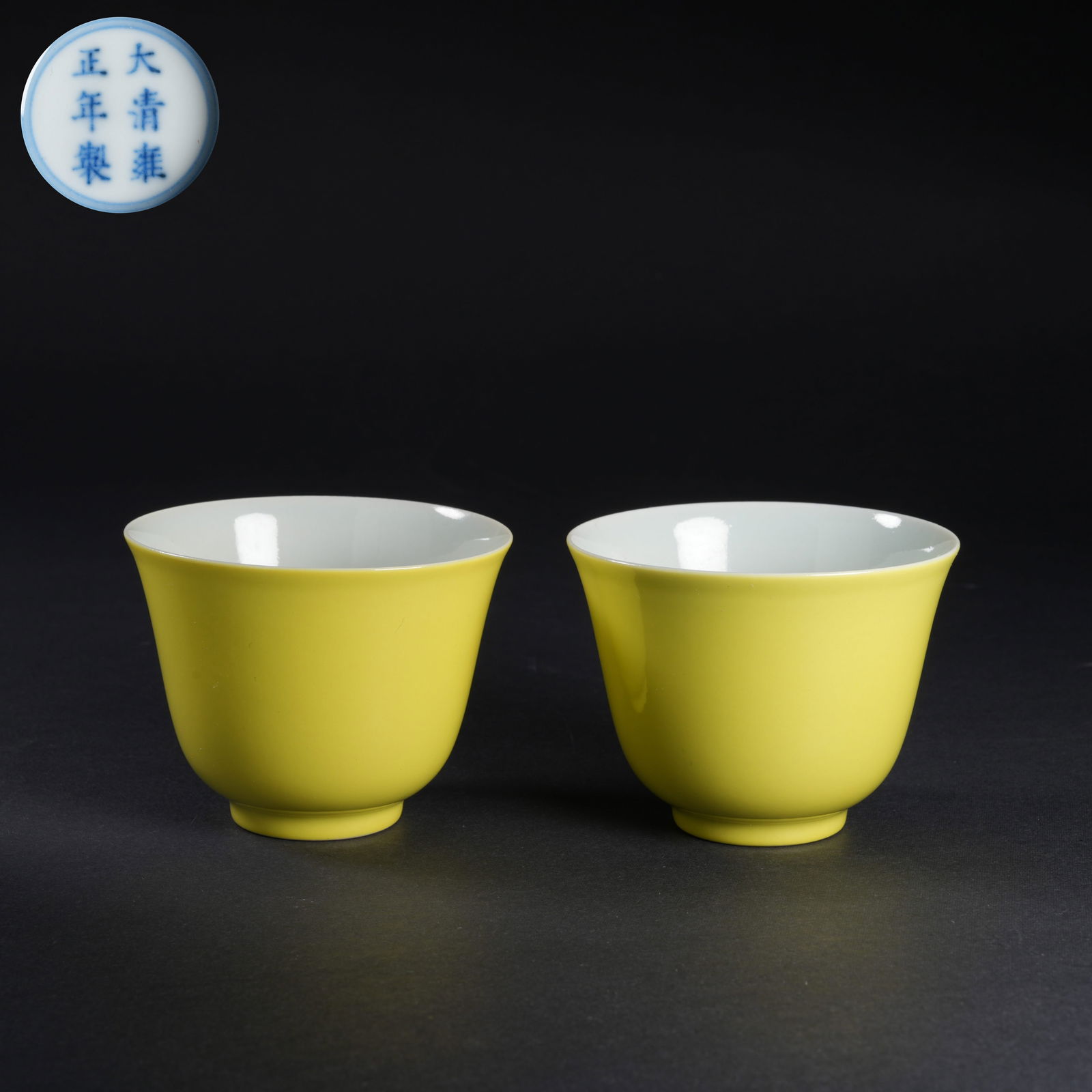 A SET OF YELLOW-GLAZED CUPS: Set of yellow-glazed cups
