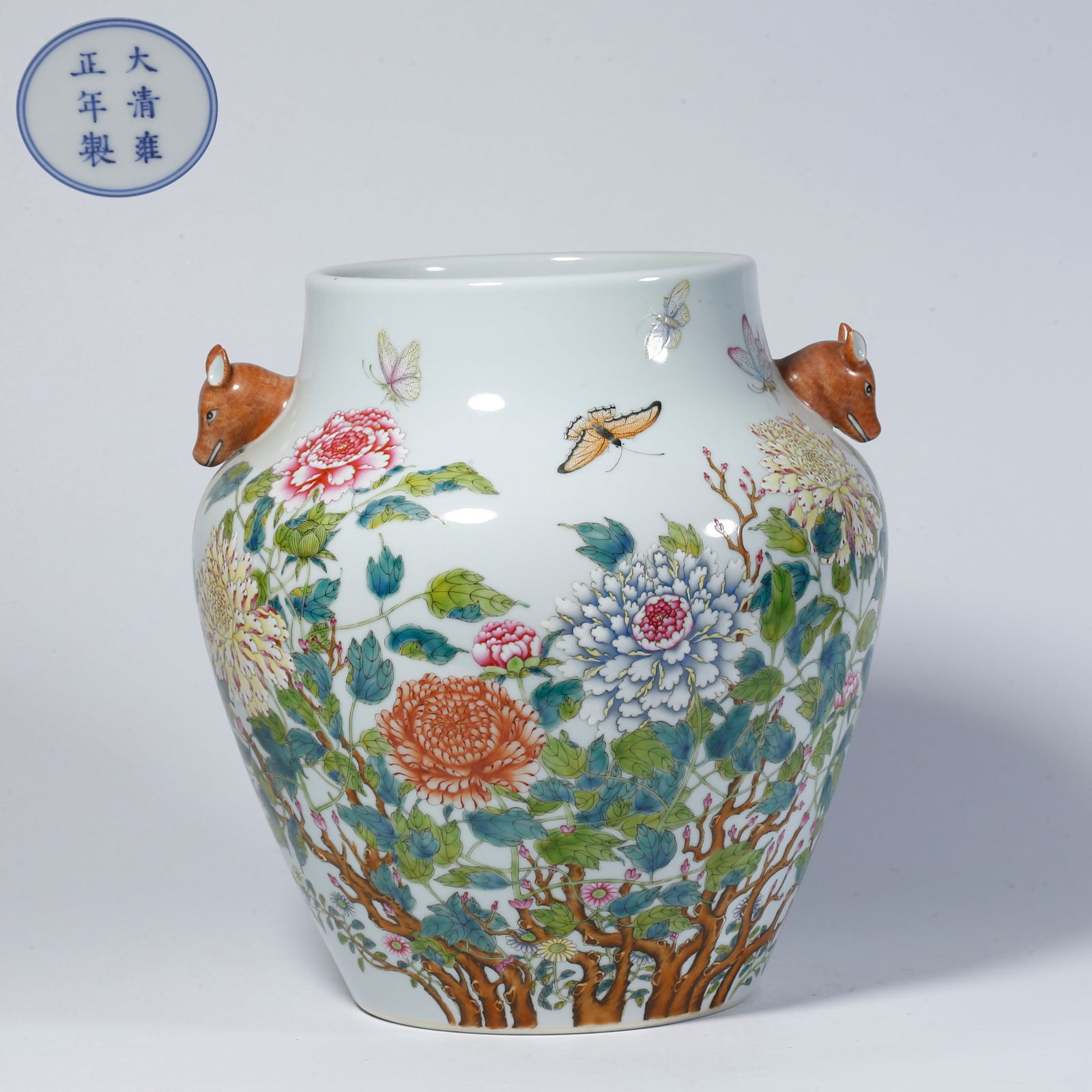 A FAMILLE-ROSE DOUBLE-HANDLED ZUN WITH FLOWER AND BUTTERFLY DESIGN: Famille-rose double-handled zun with flower and butterfly design