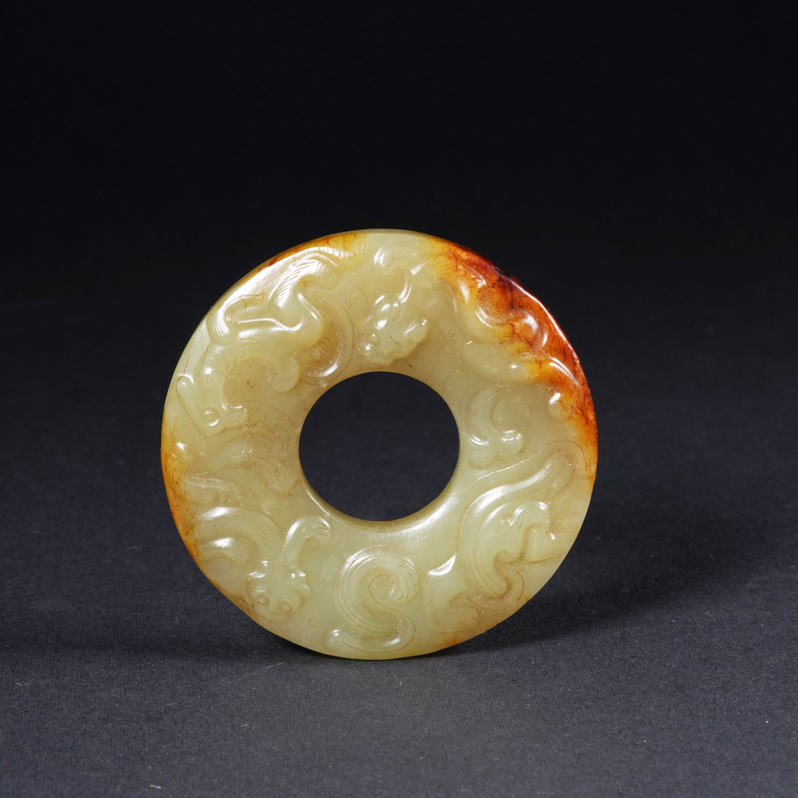 A HETIAN YELLOW JADE BI DISC WITH CHI DRAGON MOTIF: Hetian yellow jade bi disc with chi dragon motif