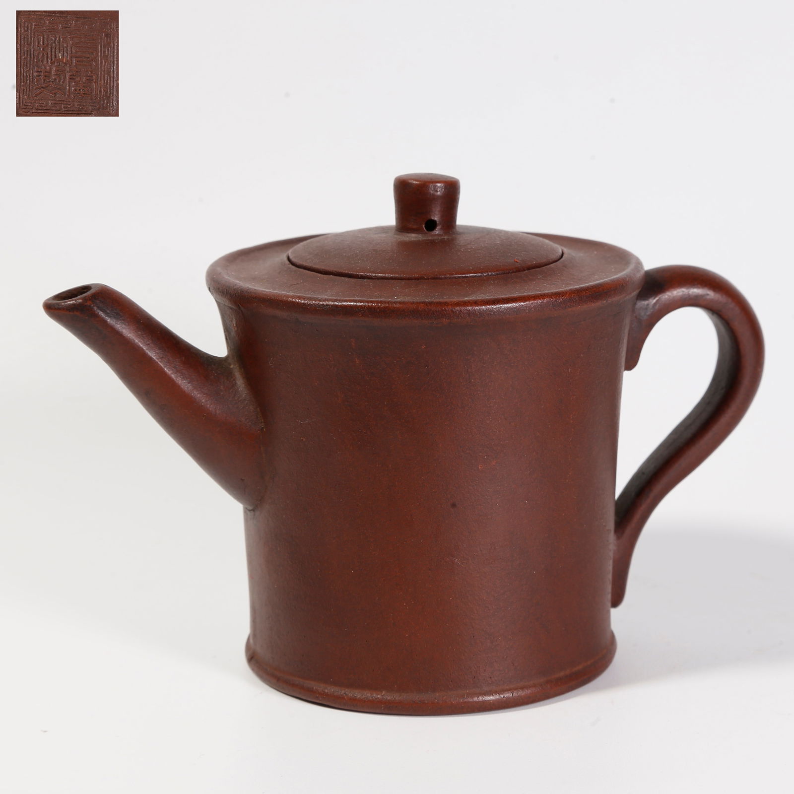 A PURPLE-SAND TEAPOT (ZISHA): Purple-sand teapot (zisha)
