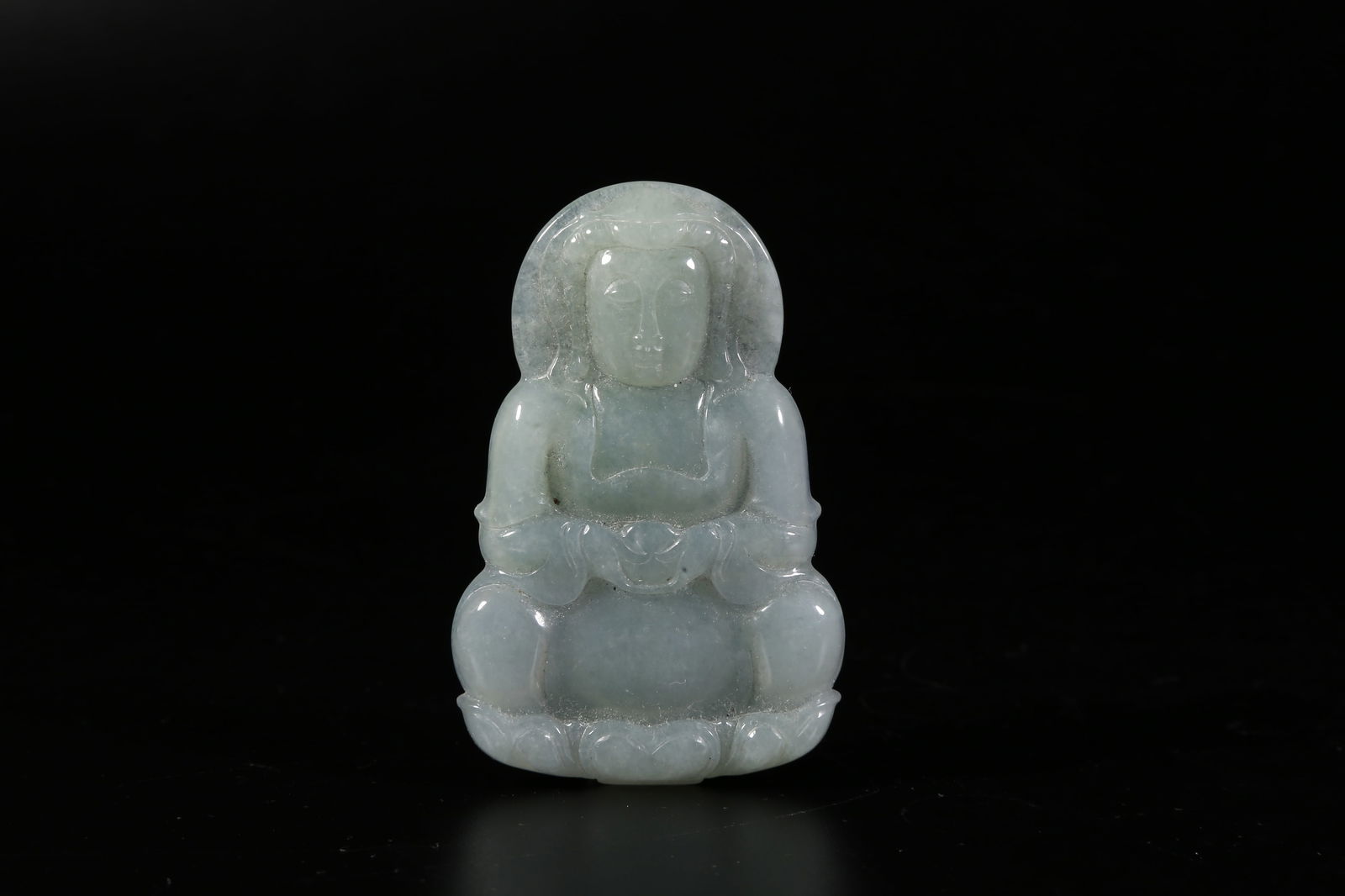 A JADEITE PENDANT WITH BUDDHA MOTIF: Jadeite pendant with Buddha motif