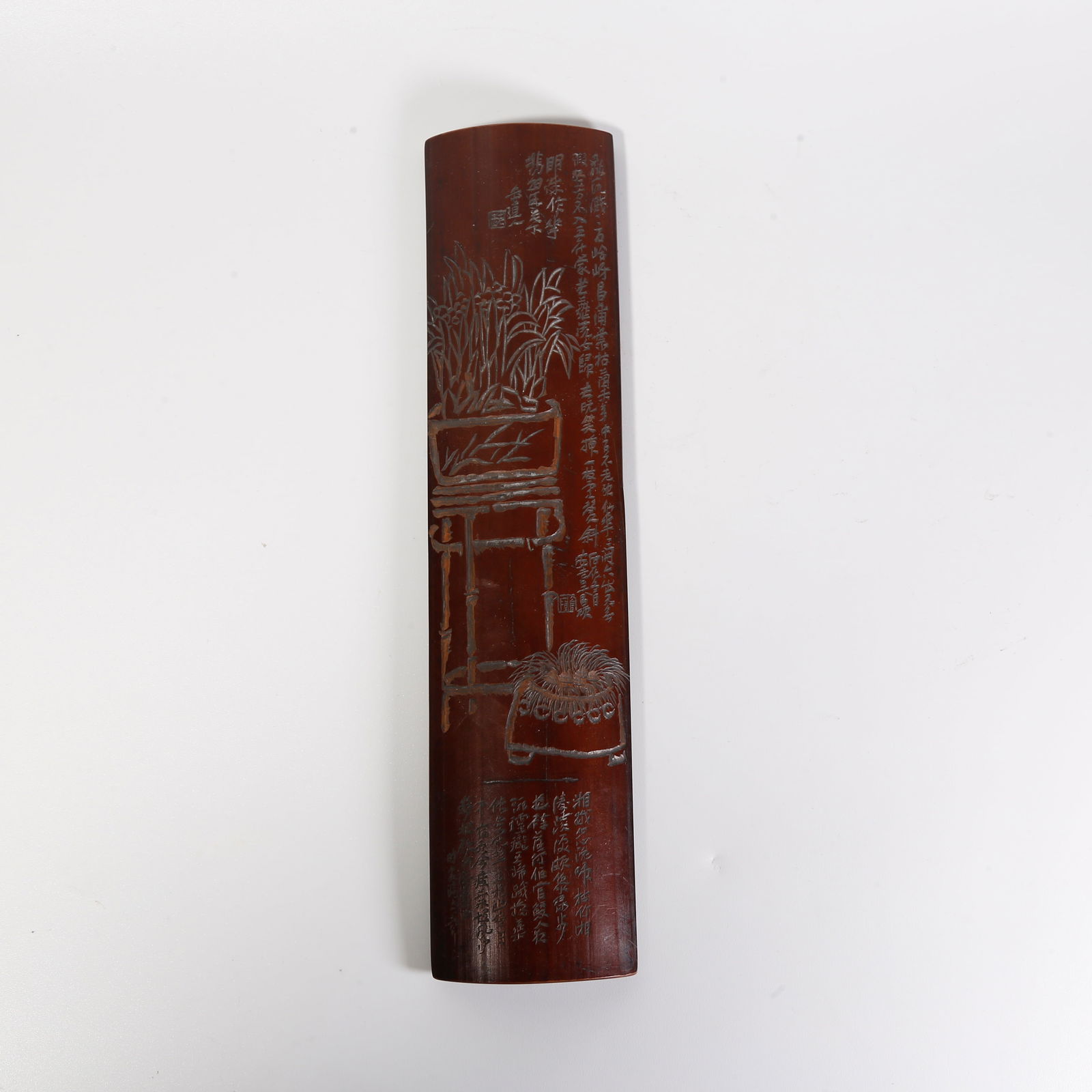 A BAMBOO-CARVED ARMREST WITH FLORAL MOTIF: Bamboo-carved armrest with floral motif