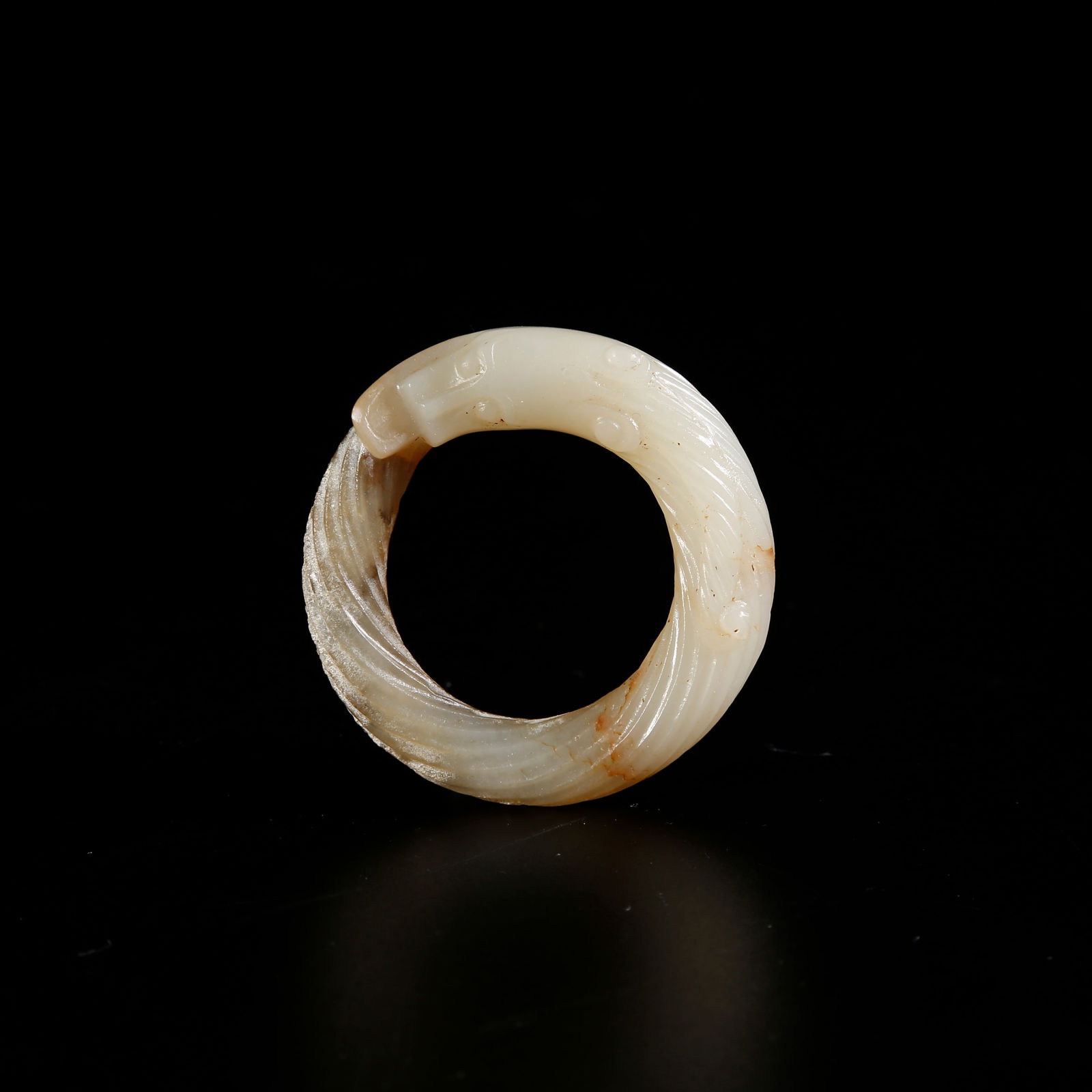 A HETIAN JADE PENDANT WITH DRAGON MOTIF: Hetian jade pendant with dragon motif