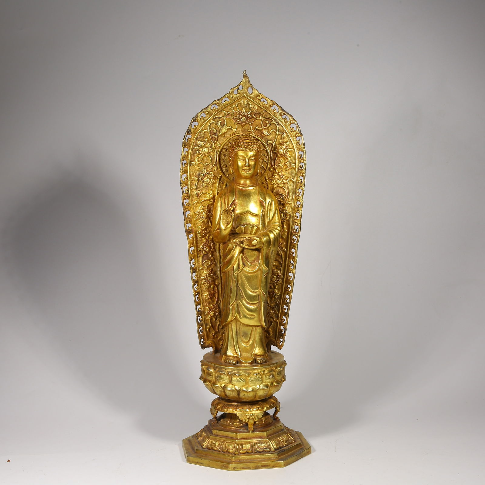 A GILDED SILVER BUDDHA STATUE (1 of 8)