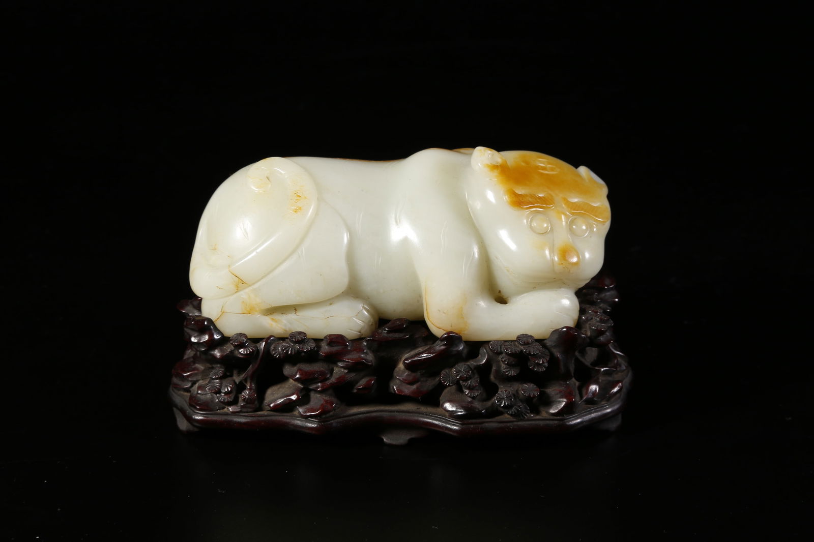 A HETIAN JADE TIGER-SHAPED ORNAMENT: Hetian jade tiger-shaped ornament