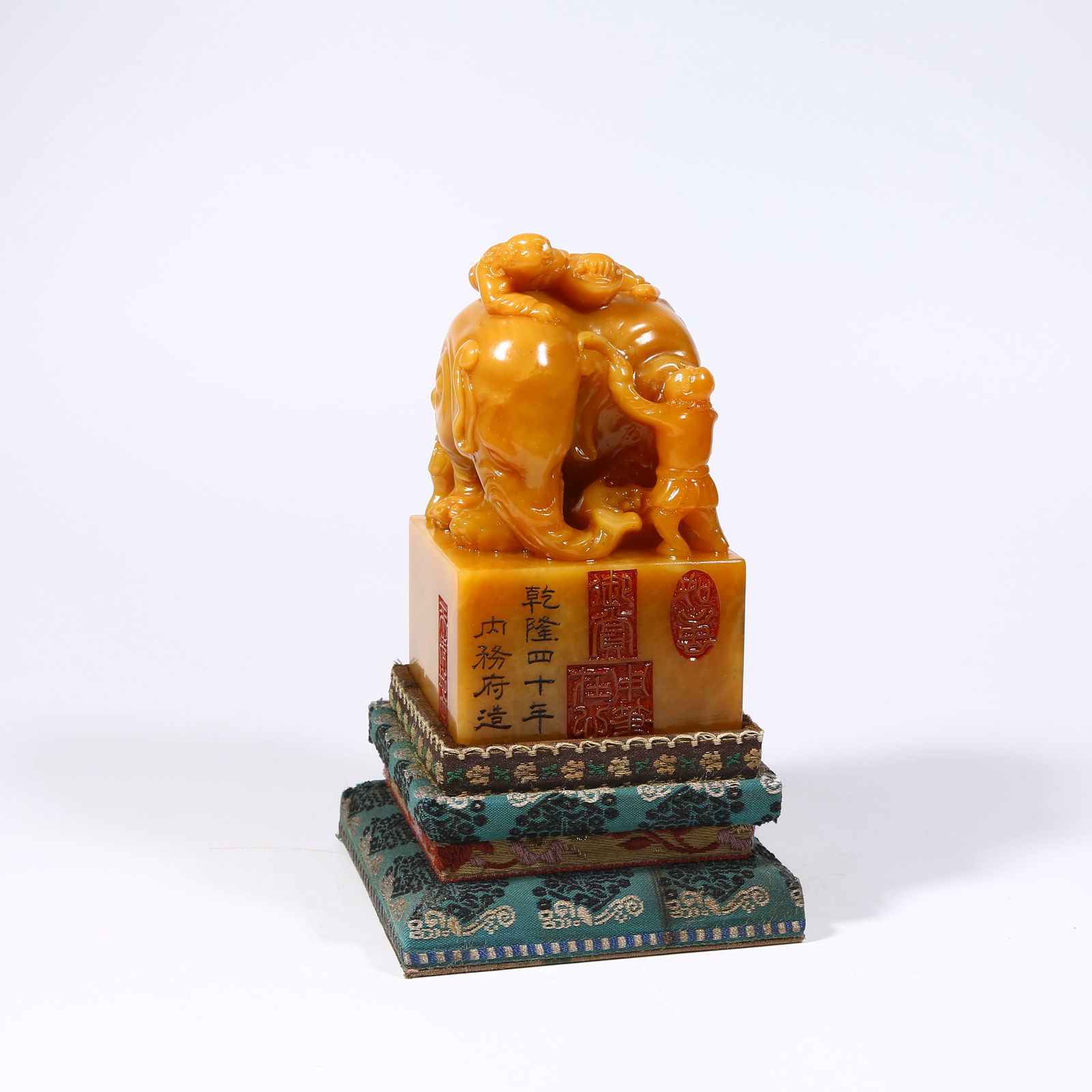 A SHOUSHAN TIANHUANG STONE SEAL WITH BOY RIDING ELEPHANT KNOB BRUSH WASHER: Shoushan Tianhuang stone seal with boy riding elephant knob brush washer
