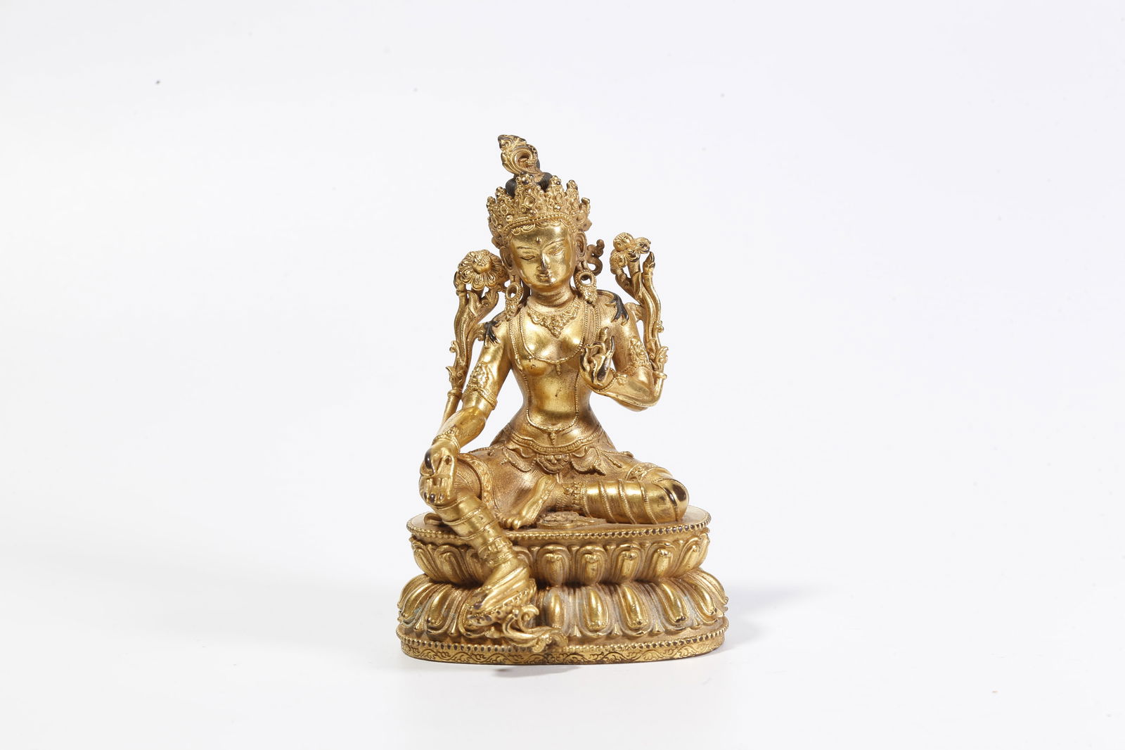 A GILT-BRONZE GREEN TARA STATUE: Gilt-bronze Green Tara statue