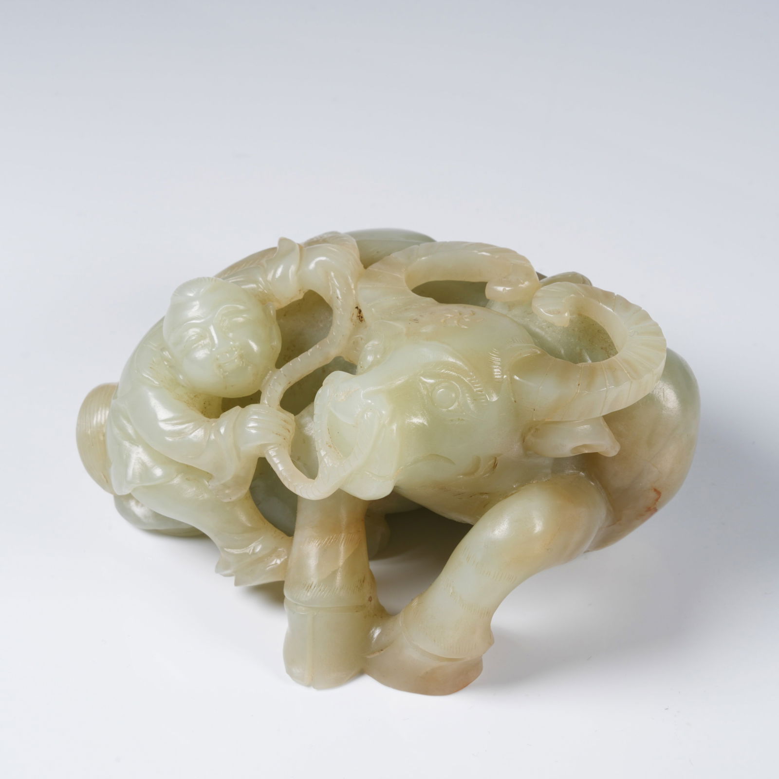 A HETIAN JADE BOY HERDING OX ORNAMENT: Hetian jade boy herding ox ornament