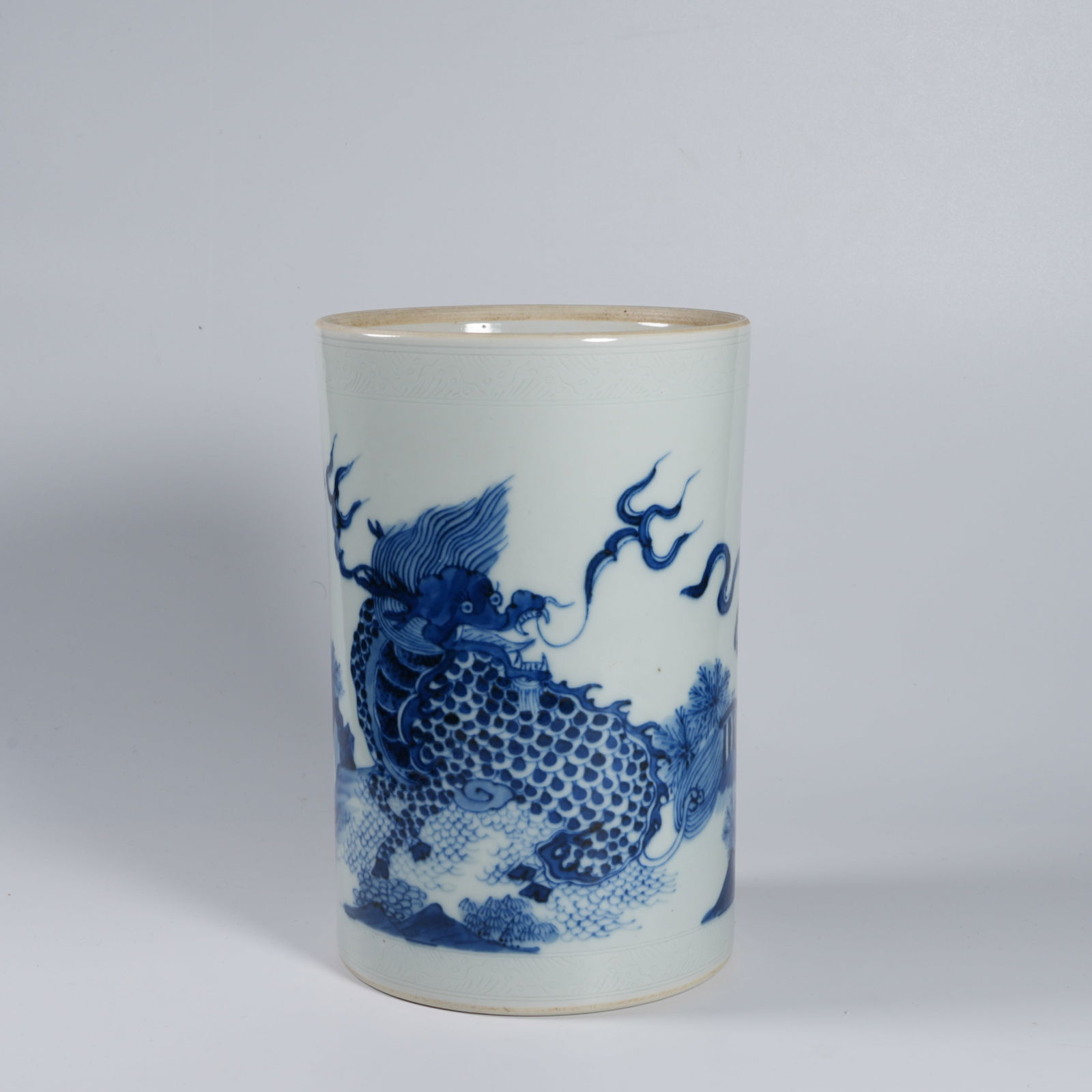 A BLUE-AND-WHITE AUSPICIOUS BEAST BRUSH POT (1 of 8)