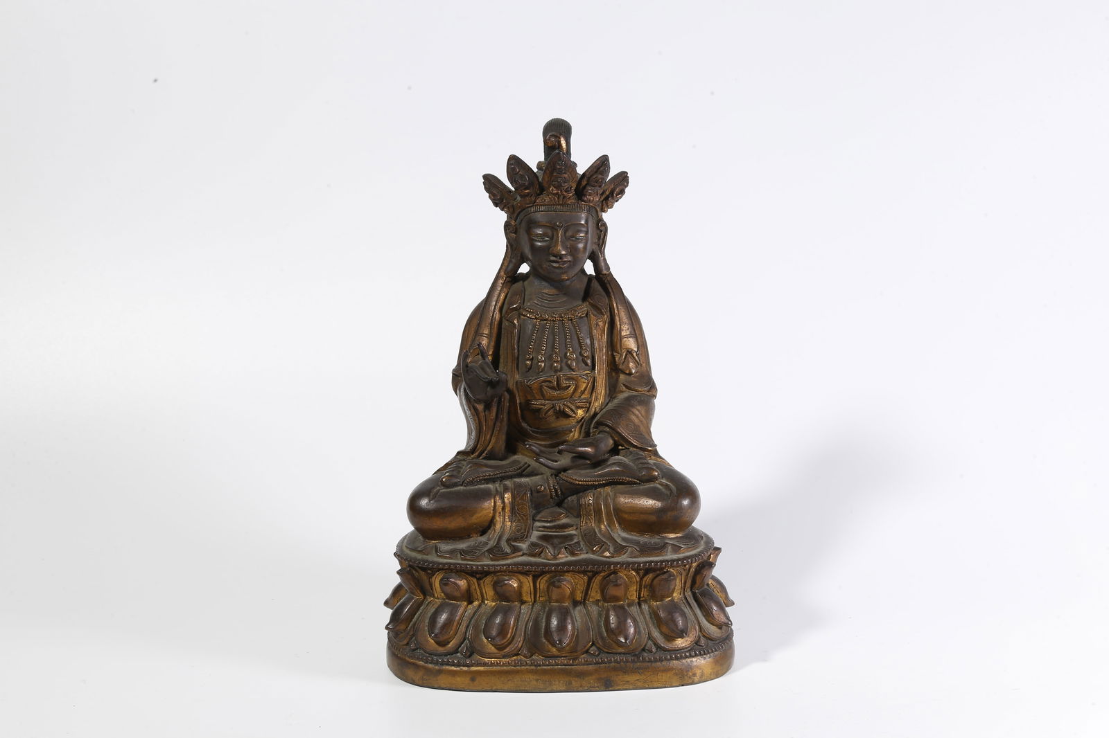 A BRONZE PARTIALLY GILT BUDDHA STATUE: Bronze partially gilt Buddha statue
