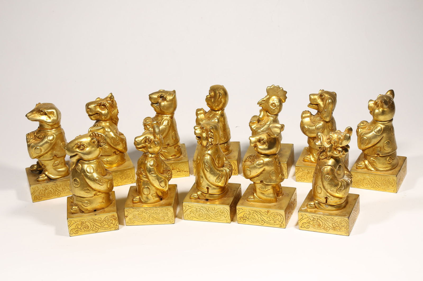 A GILDED BRONZE SEAL SET WITH TWELVE ZODIAC KNOBS - 9