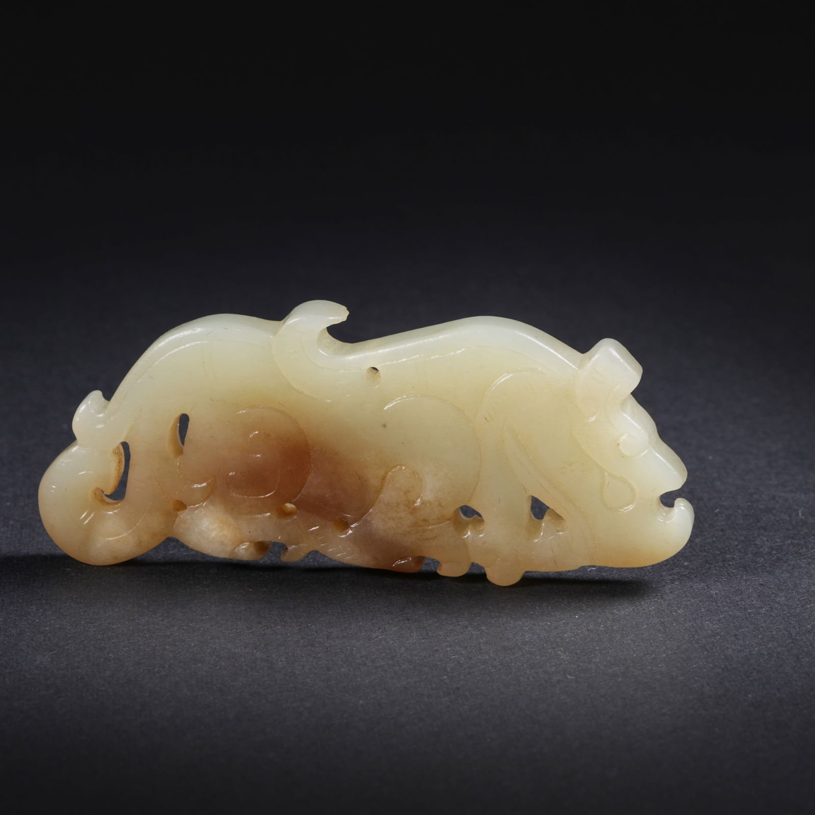A HETIAN JADE MYTHICAL-BEAST PENDANT: Hetian jade mythical-beast pendant