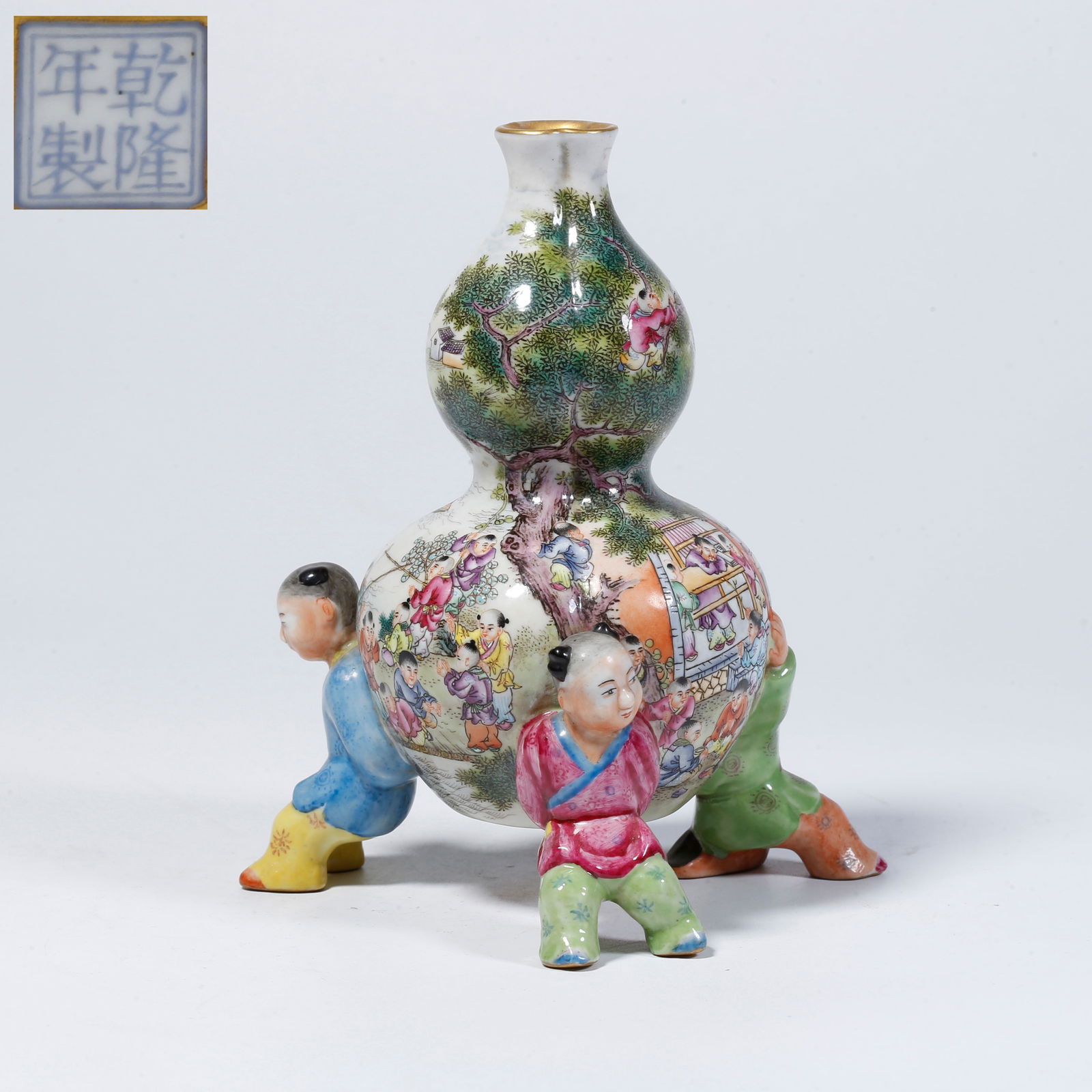 A FAMILLE-ROSE GOURD VASE WITH BOYS AT PLAY MOTIF: Famille-rose gourd vase with boys at play motif